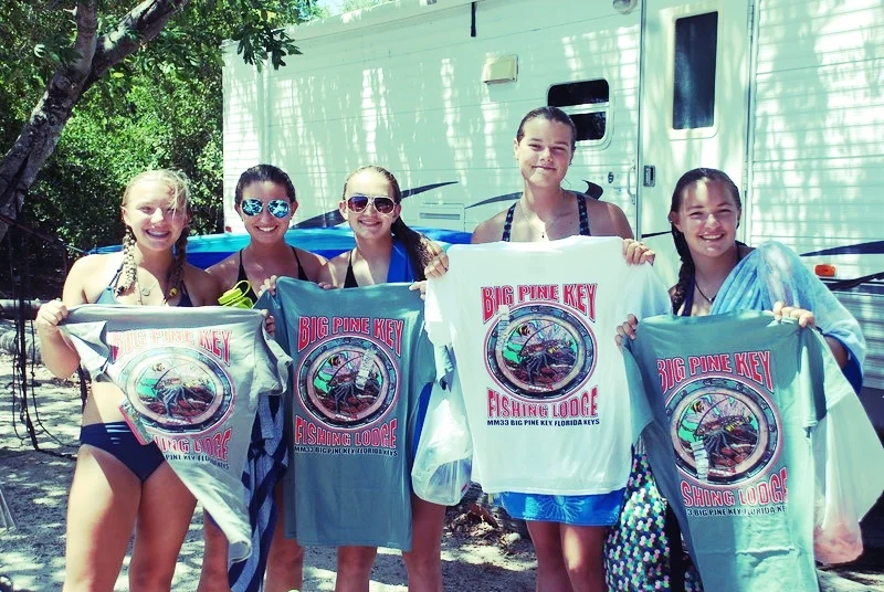 The brave, wise "TeePee Women" commemorate their last year at Coral Reef Week with Big Pine Key Fishing Lodge t-shirts. 