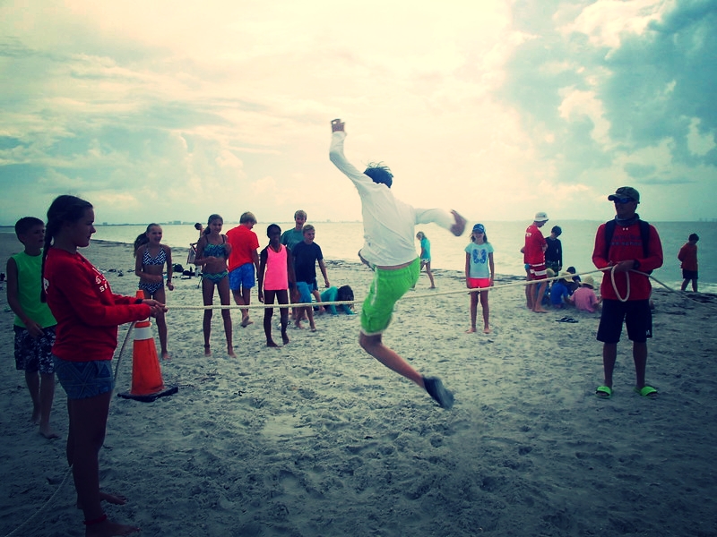 Campers show off their "worm skills" in a marine worm obstacle course. 