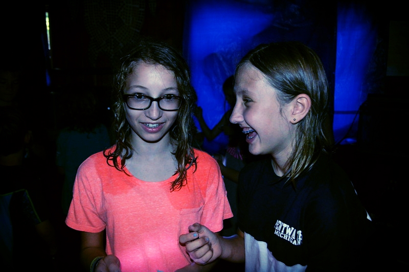 Glow My Mind Week campers practice communicating with light.