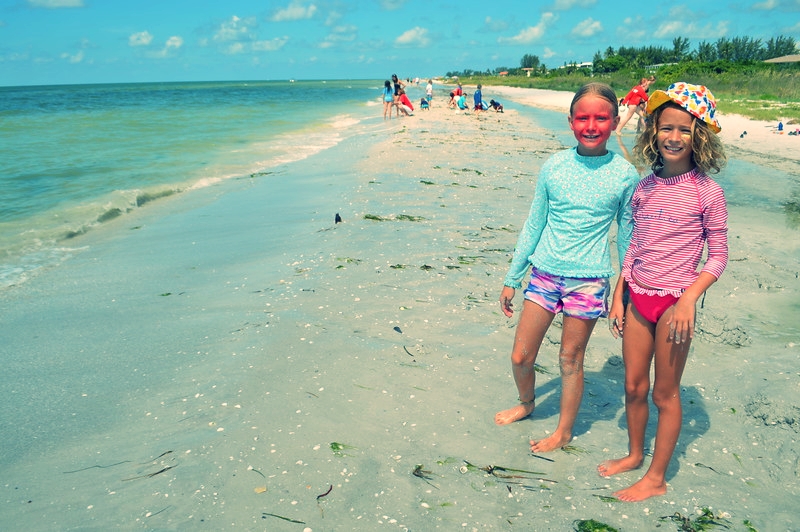 Campers show off their tribal "war paint" before the weekly surf paddling race. 