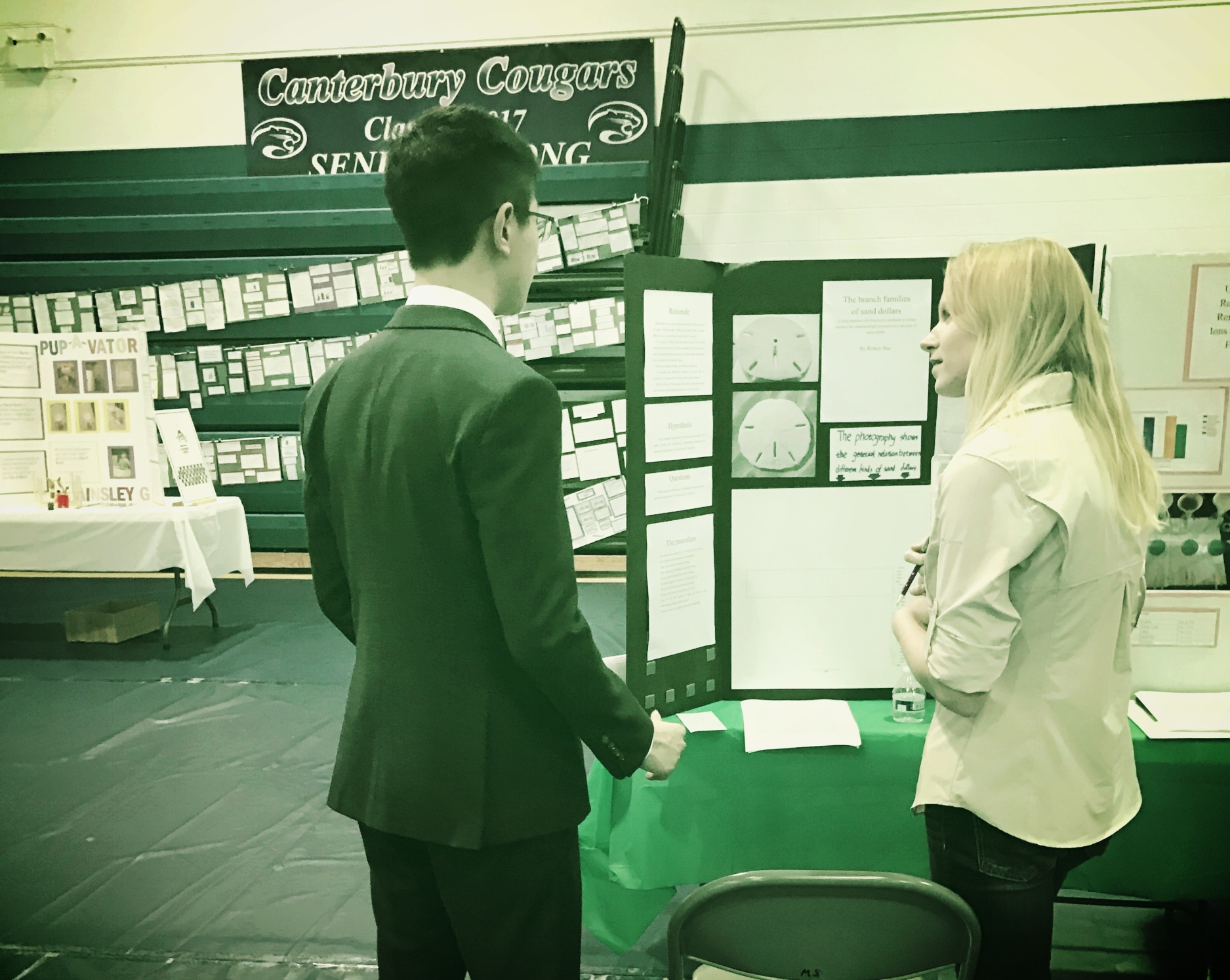 Nicole Finnicum Interviews a student about his science fair research. 
