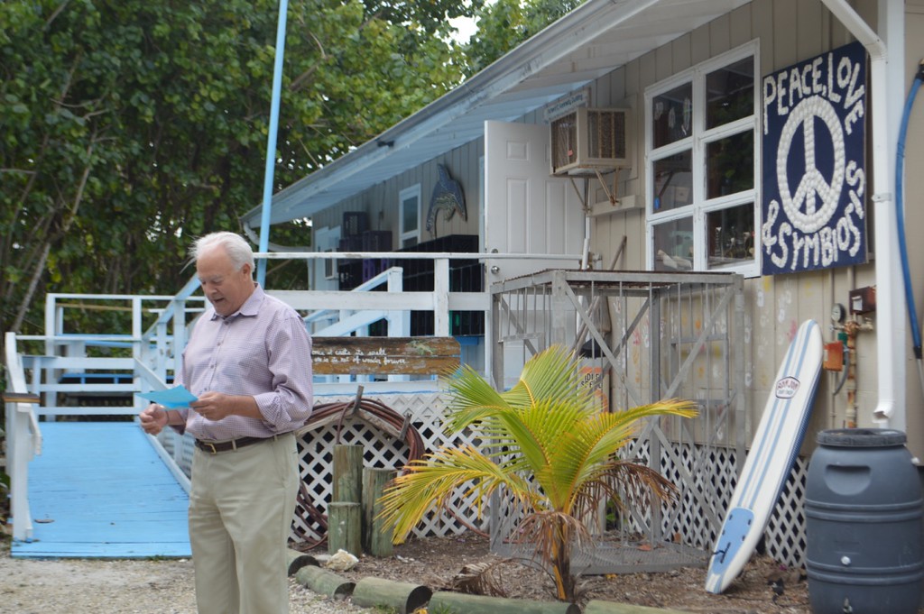 Sanibel Sea School Trustee Chip Roach reads a limerick he composed in honor of Kennedy. 