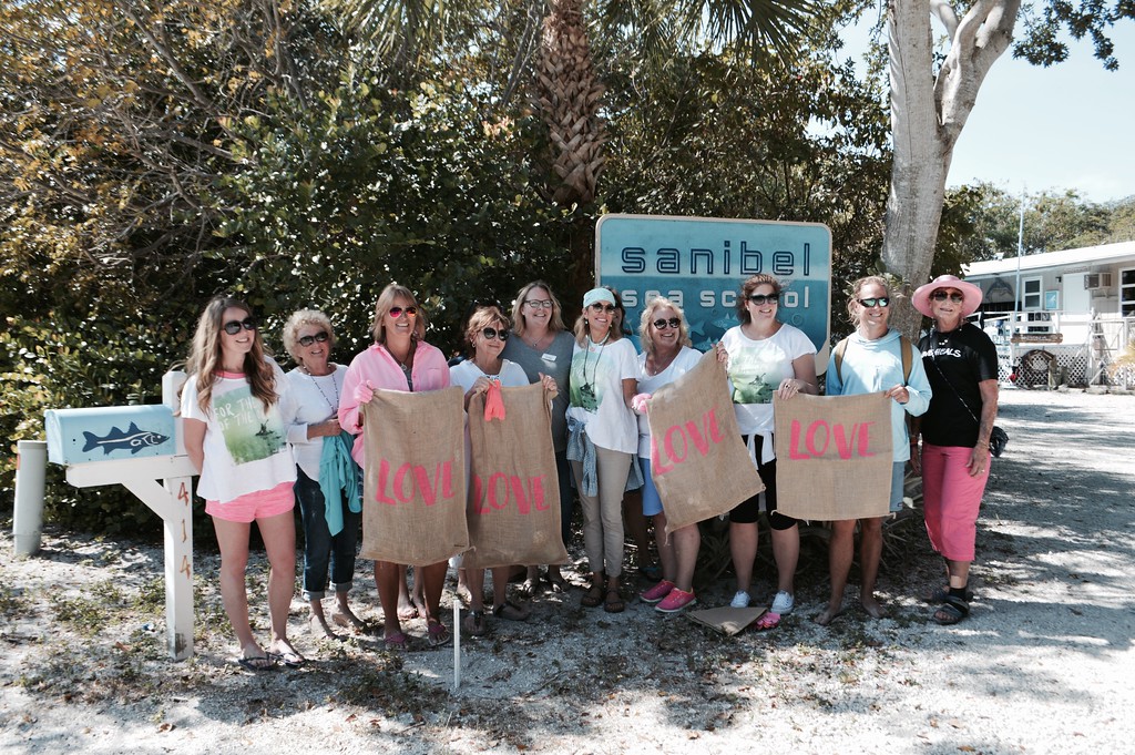 Event participants posed for a photo after cleaning up Colony Beach. 