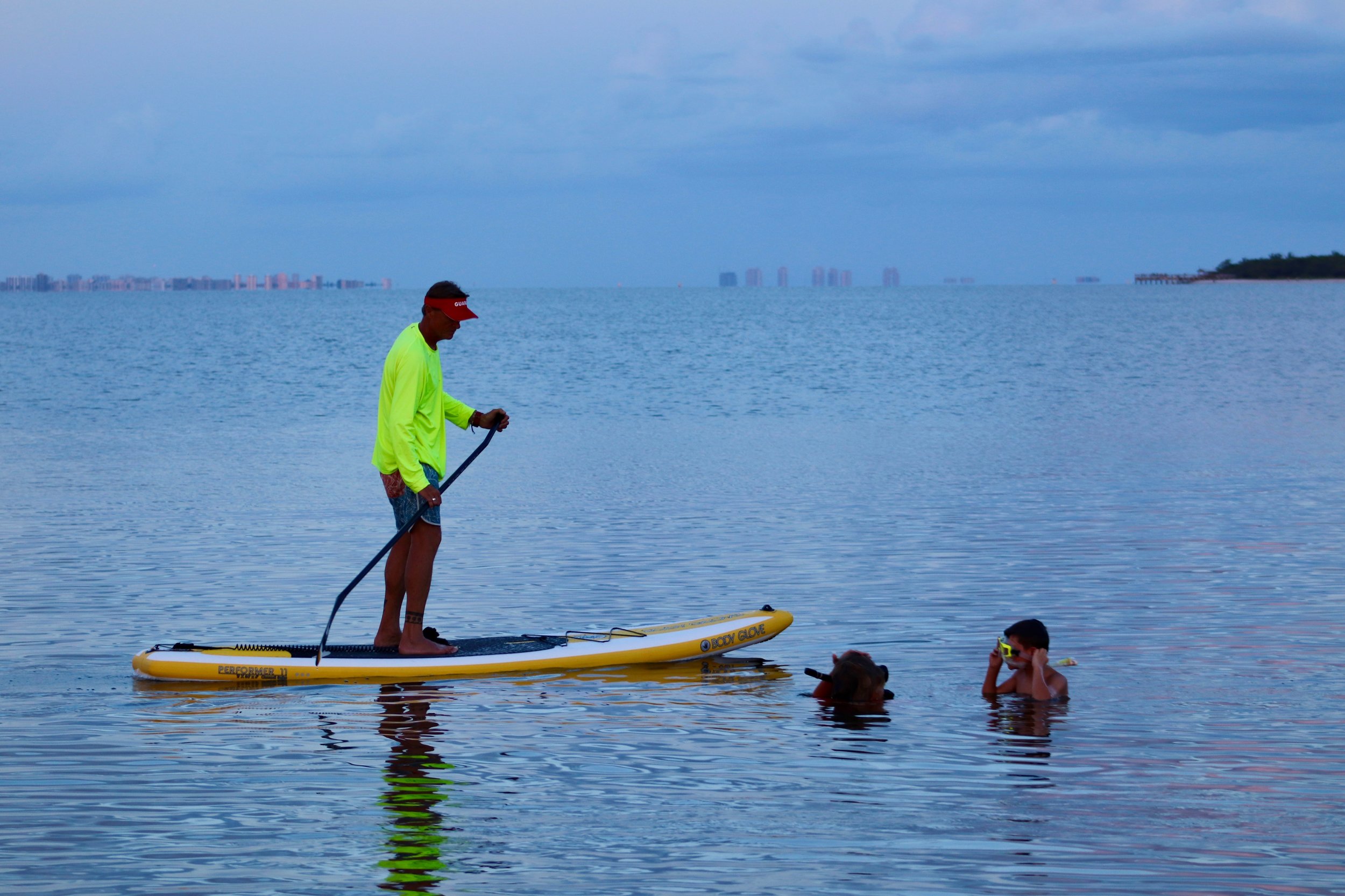 Doc Bruce watched over night snorkelers from his stand up paddleboard. 