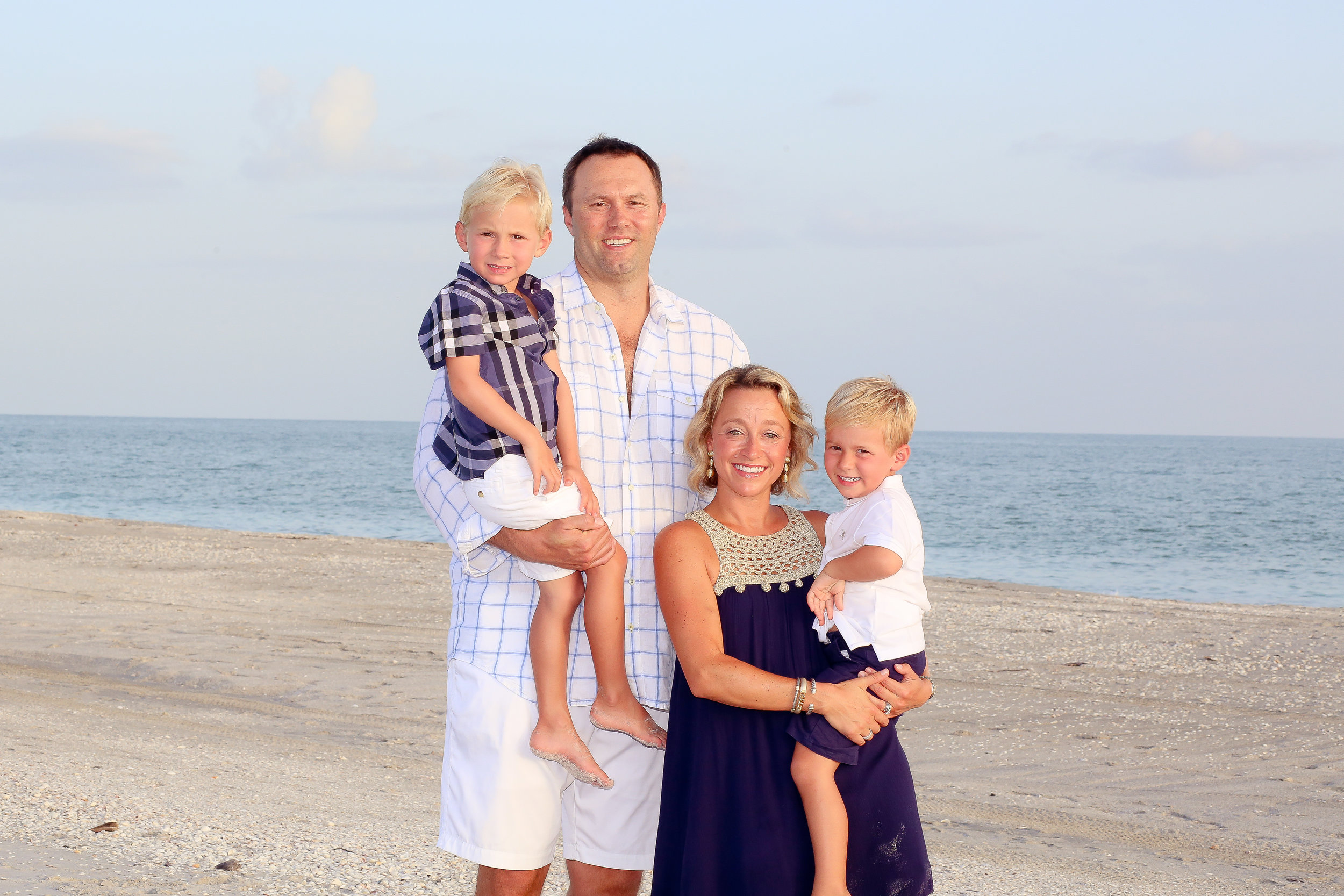 Christine Szymanczyk with her husband, Kyle, and their two sons.&nbsp;