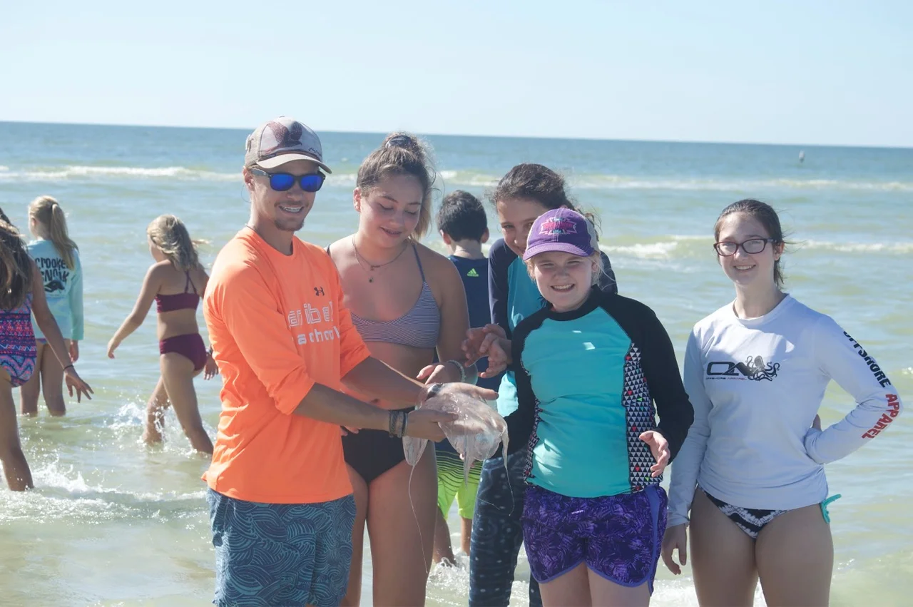 Community camp participants posed for a photo with a moon jellyfish.