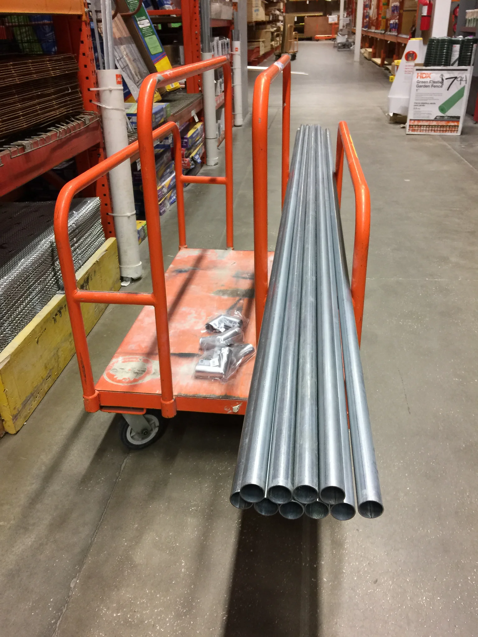 Shopping for pipe at Home Depot. Decided to go with the top rail for chain-link fences, which is 1-1/4" galvanized (this is what Dan Gaye of Studio75 used, in the Scott Kelby post).