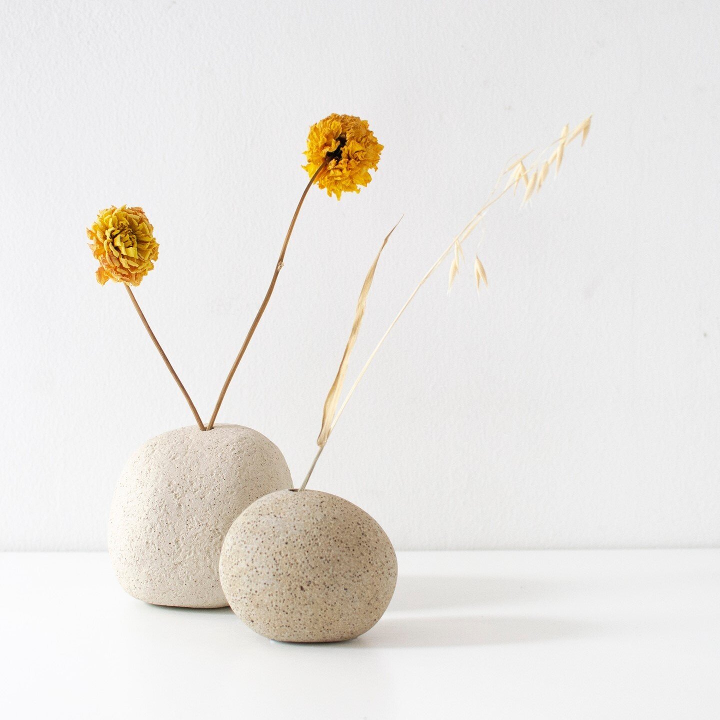 New work by @katie_timson has arrived at the gallery! How beautiful are these pebble vases 💛 They are made from a variety of different clay body mixtures and look fab with a dried stem or two!⁠
⁠
Now available online and in the gallery:⁠
www.cambrid