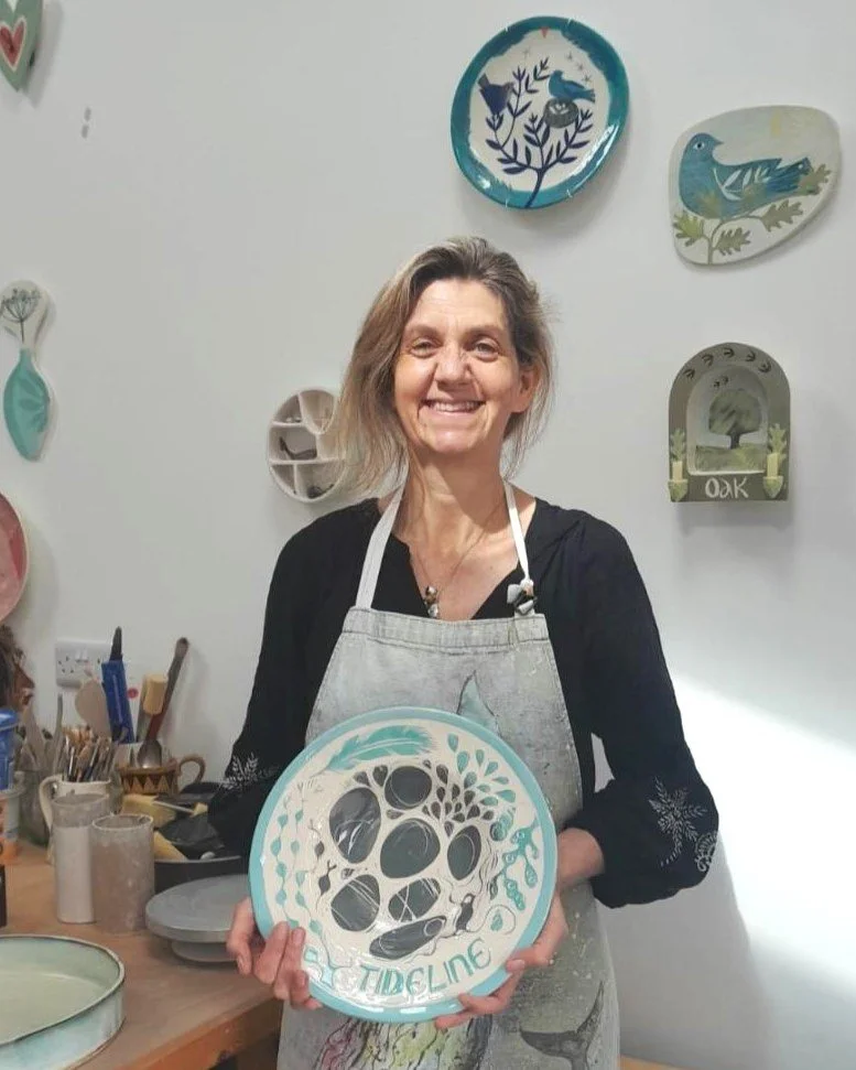 A lovely photo of artist Alice Gare in her studio! Alice works in her converted old blacksmiths workshop on the North Devon/Cornwall border with a view of sea. 

To create her ceramics Alice uses a smooth Earthenware clay, then layers coloured slips 