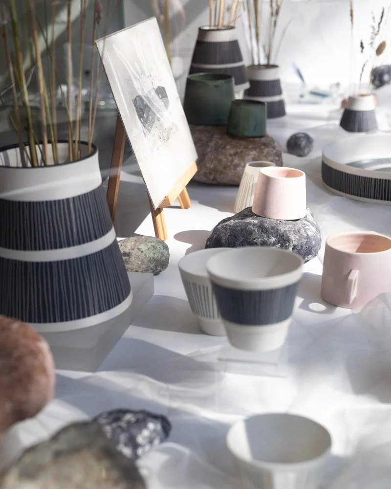 Vicky Hagman is one our artists currently featured in our window display and we love how the textures and muted colours look displayed together with natural objects. 

 Vicky's work balances clean, contemporary forms with the tactile patterns and gla