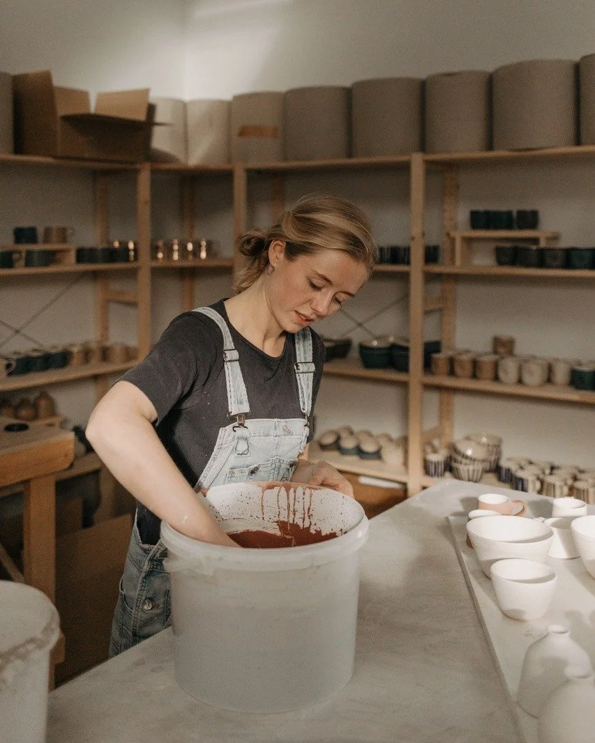 A fantastic image of Emily Tapp working in her studio! Emily (otherwise known as EOT Ceramics) is currently one of our featured artist with her work in our window display.

Emily makes wheel-thrown ceramics intended for daily use from her studio at A