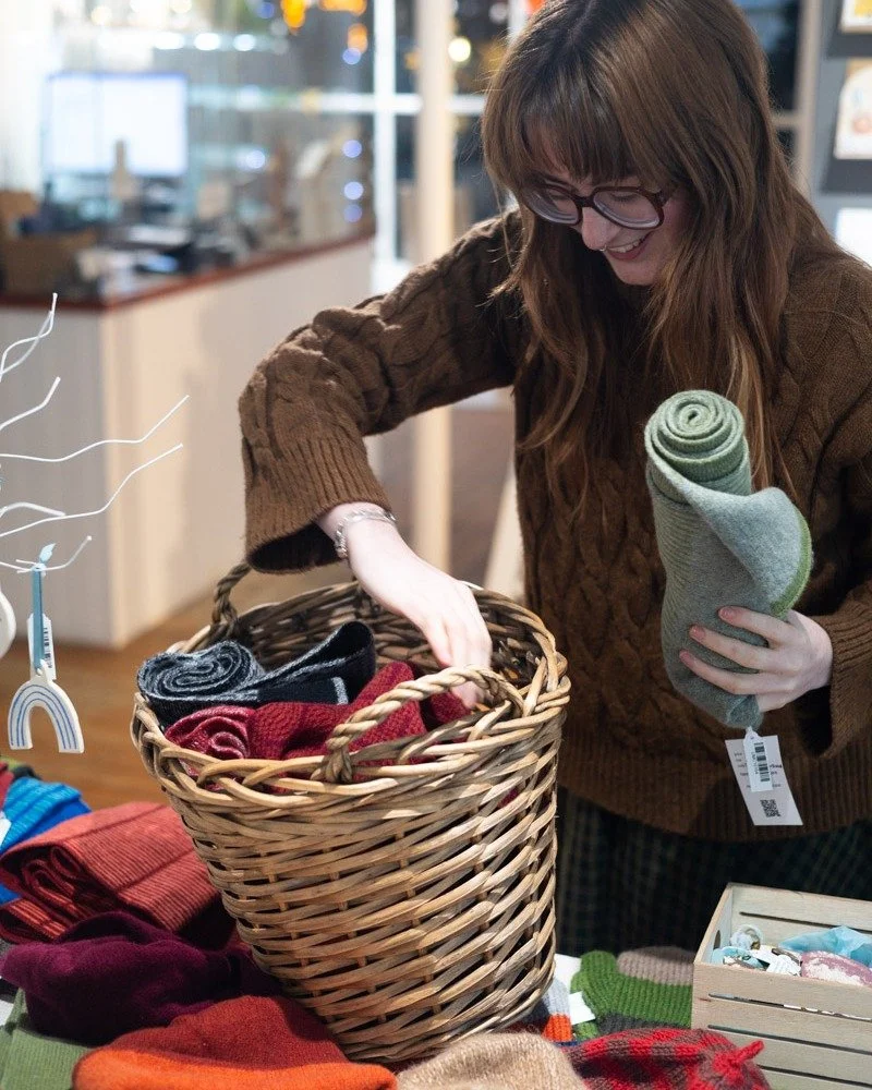Happy December 1st! We're keeping our knitwear stocked up for the festive season. Take a look at our cosy offerings from UK knitwear artists in the gallery! 

In this pic we're filling a basket with scarves by Zoe Miller (aka Tangent Accessories) and