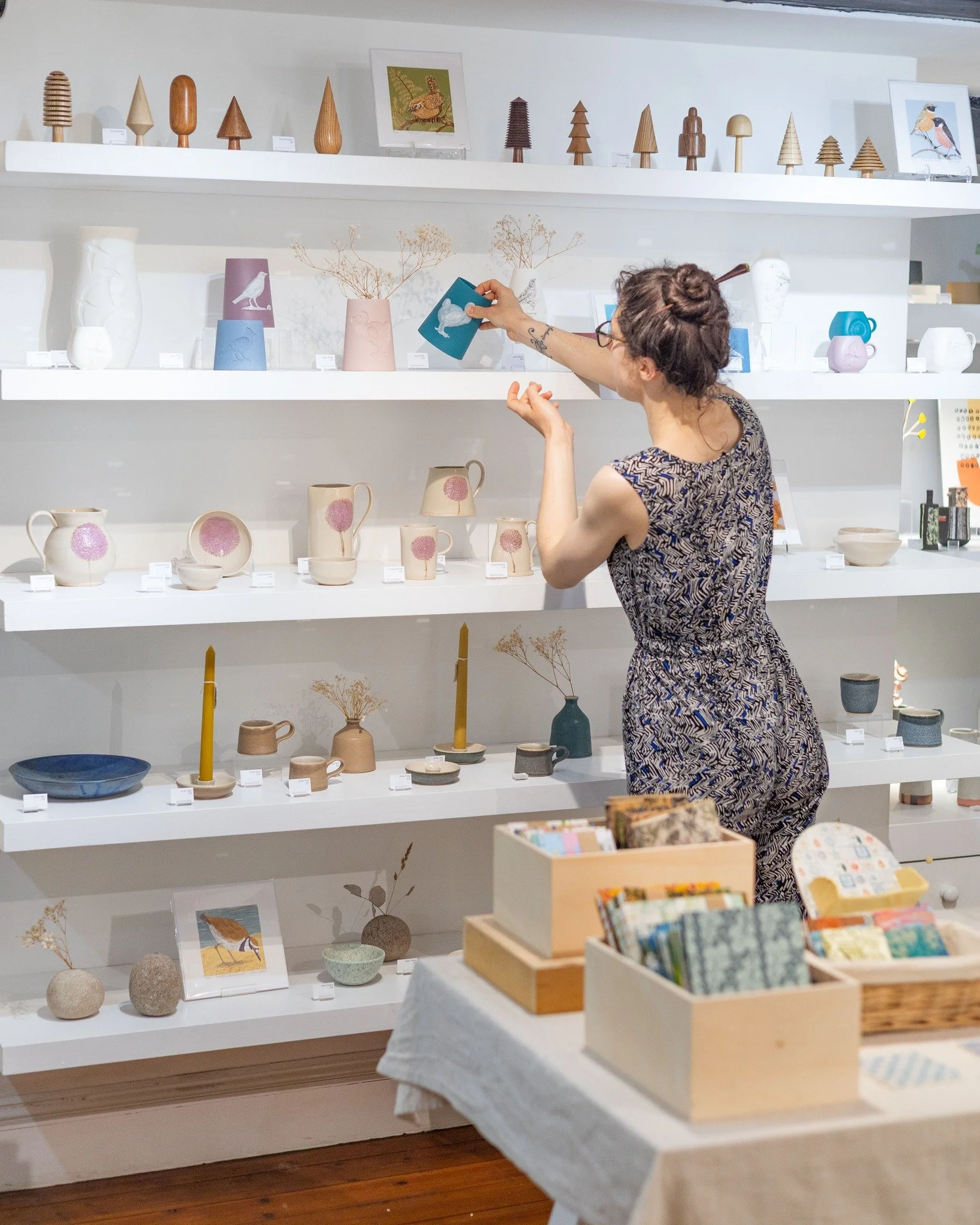 Our displays are full of new pieces by UK craftspeople. You can see the themes of nature in these shelves that each artist has captured in their own way. 

All prints are by Paula Boyd-Barrett, ceramics and sculptures from the top shelf down are by:
