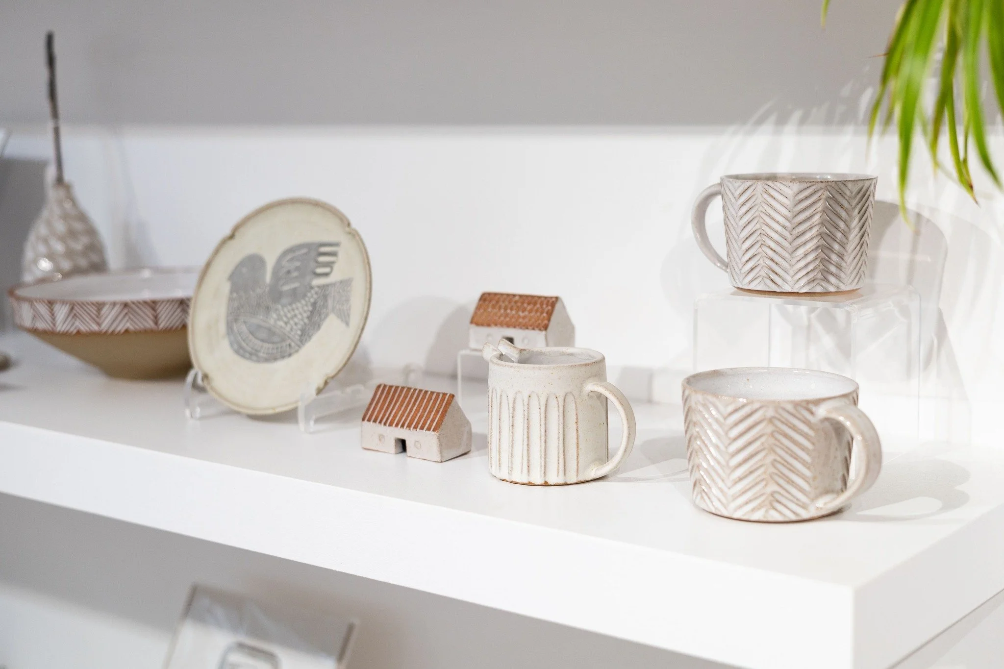 K Ceramics looking lovely and calming on display! Kate uses the wheel and hand building to create her pieces. She brings them to life with her carving and mark making techniques - we love how tactile they are to hold! 

Hare print by Folded Forest!

