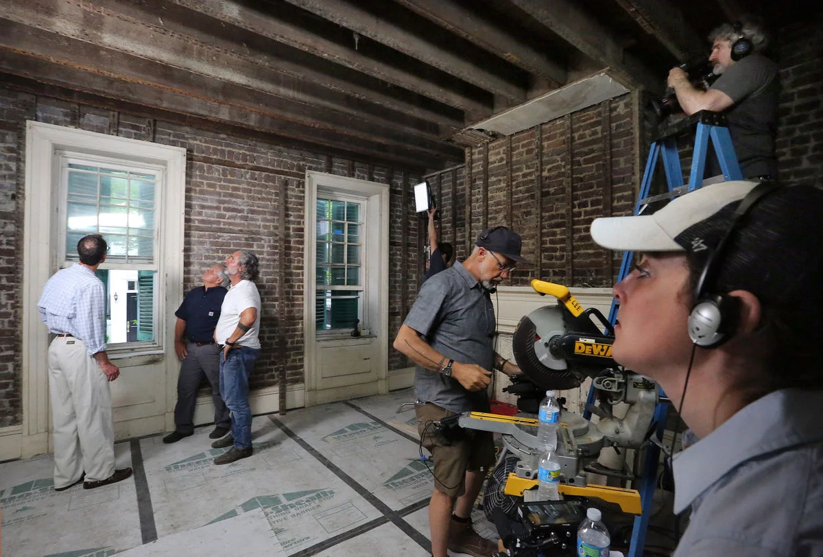 Owner Scott Edwards (left) prepares to film a scene for "This Old House" with the show's general contractor Tom Silva (middle) and Mark Regalbuto (in white) of Renew Urban on Wednesday, May 24, 2017. Brad Nettles/Staff. Brad Nettles bnettles@postandcourier.com