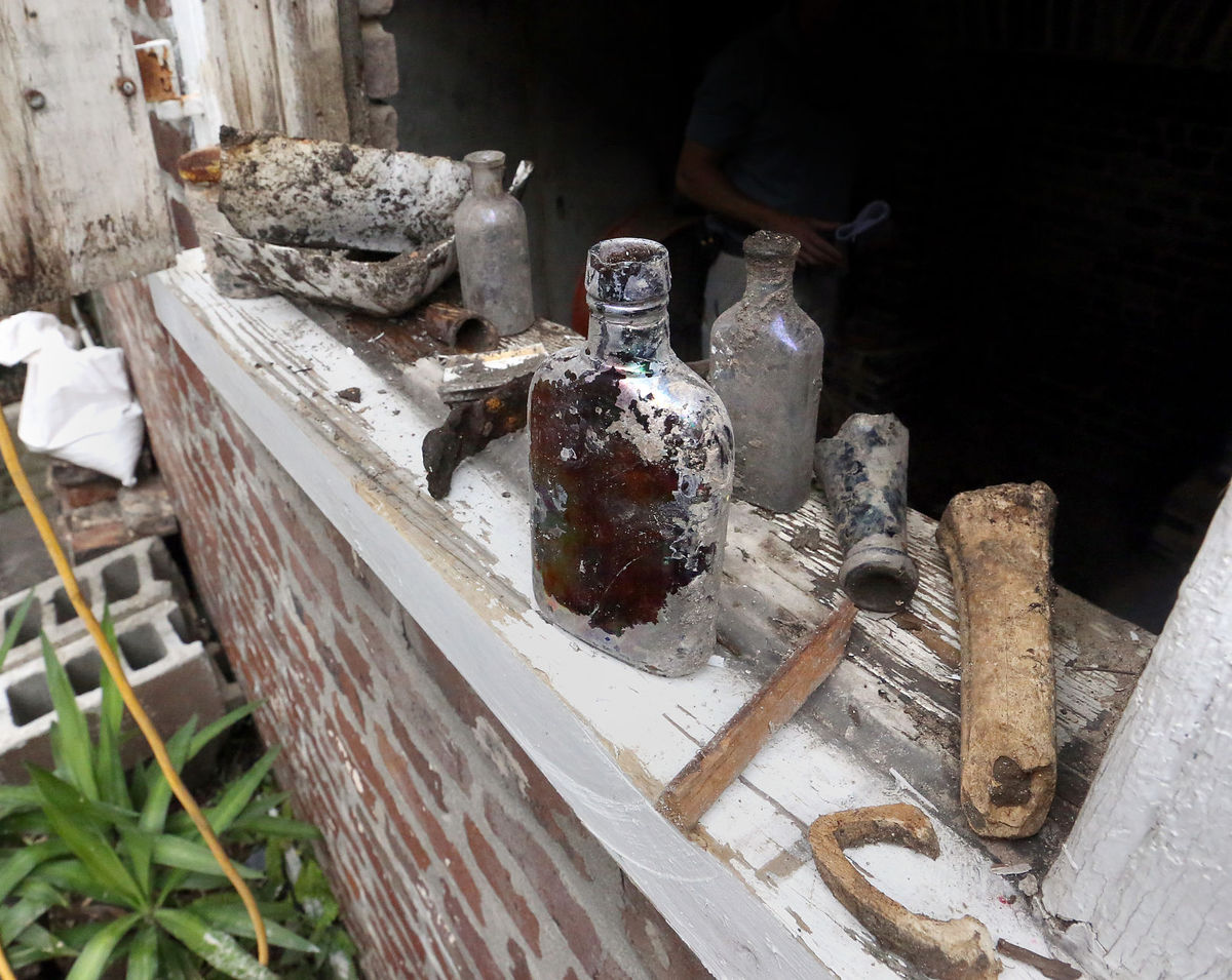 An excavation of a privy behind the Ansonborough home turned up these old items, including many bottles and buttons. Brad Nettles/Staff. Brad Nettles bnettles@postandcourier.com