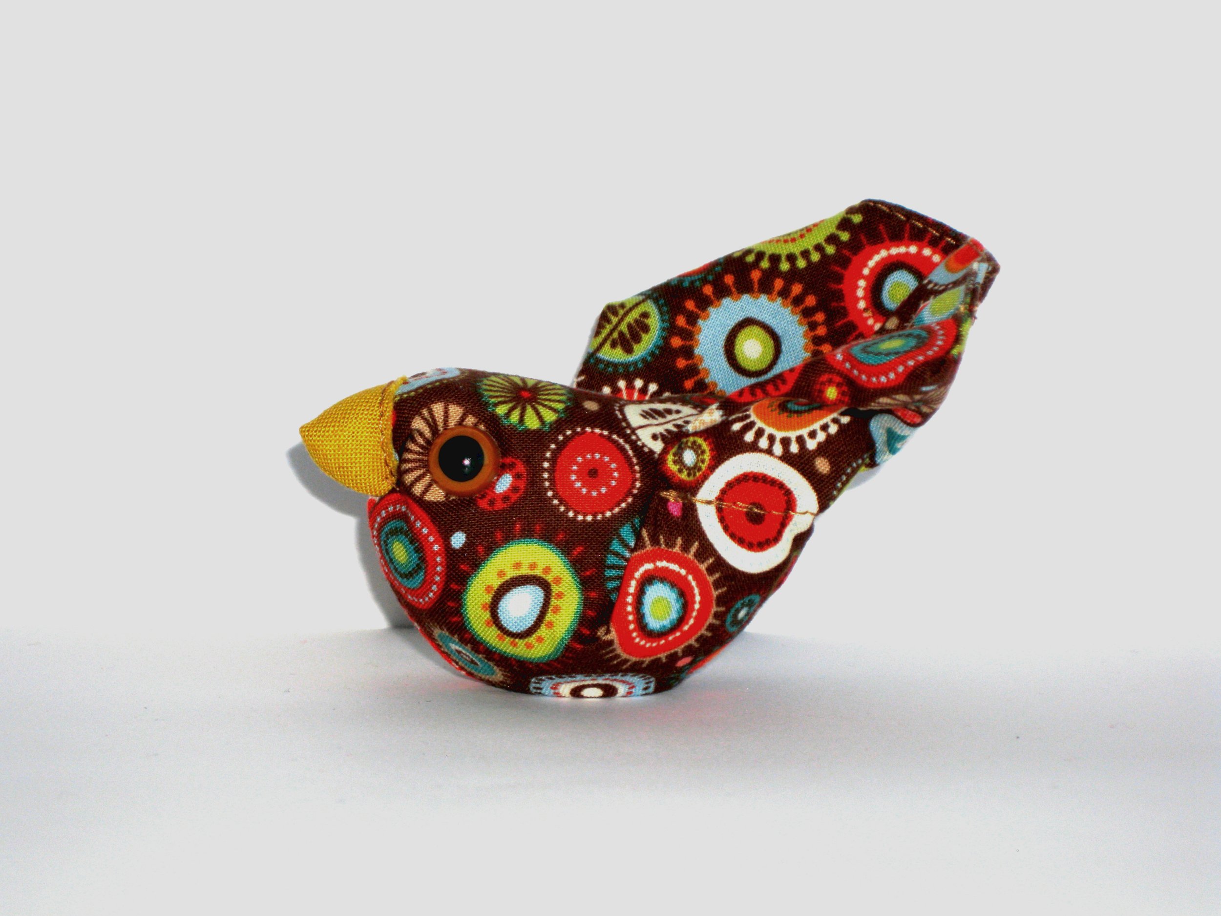 multicolor_lightbrowneye_mustardyellowbeak-profile1.jpg
