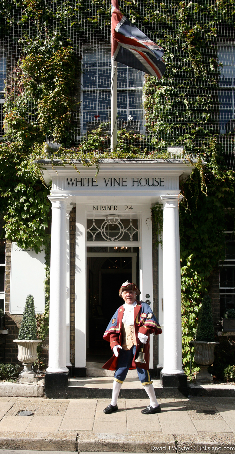 Rye's Town Crier - the Google of Yesteryear - outside Rye's White Vine House Hotel