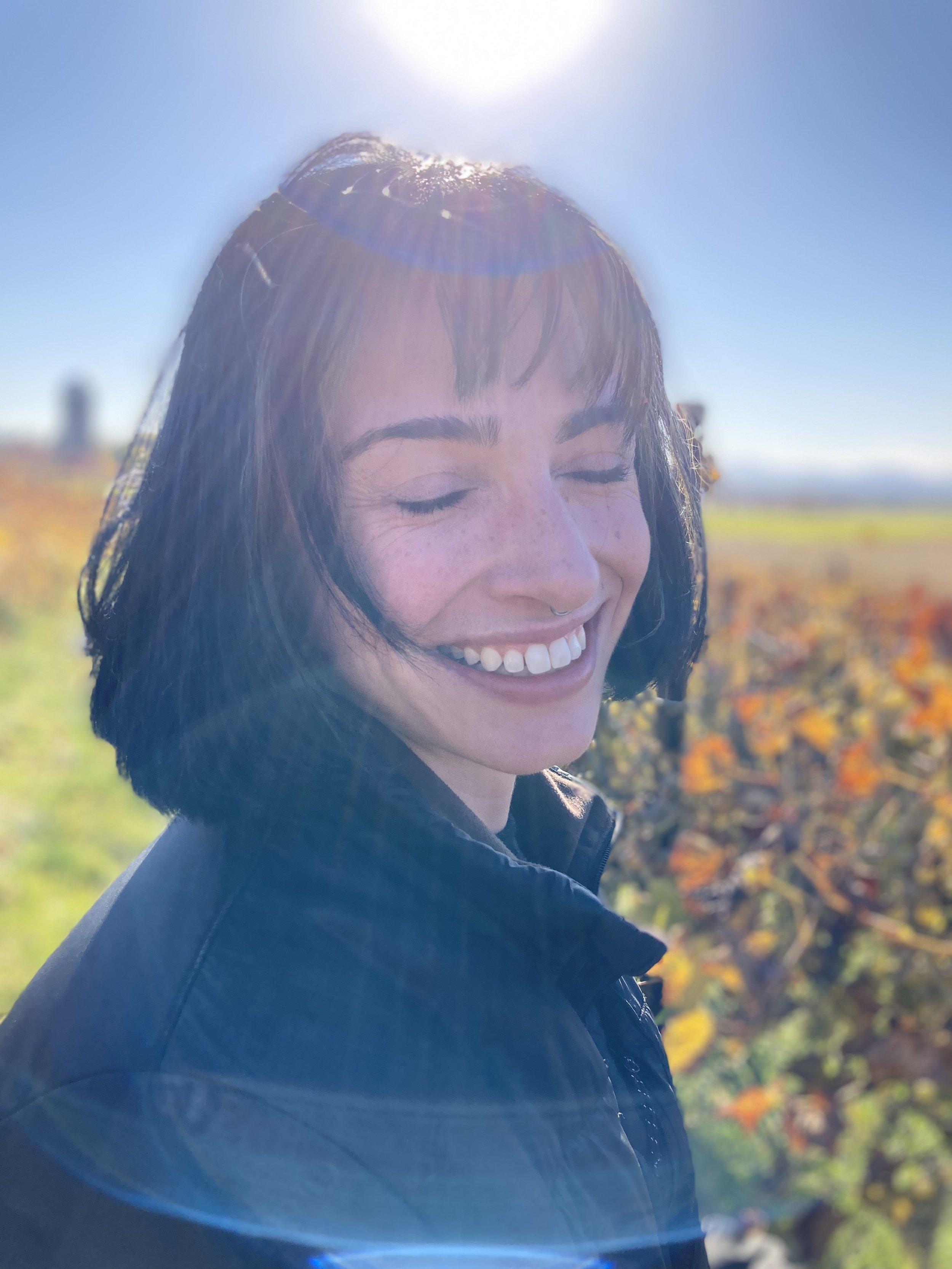 photo of Anna with eyes closed in VG vineyard by Katie Lenhart.jpg