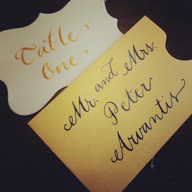 Metallic Bronze Ink on Ivory Place Card. Navy Ink on Shimmery Gold Enclosure Envelope.