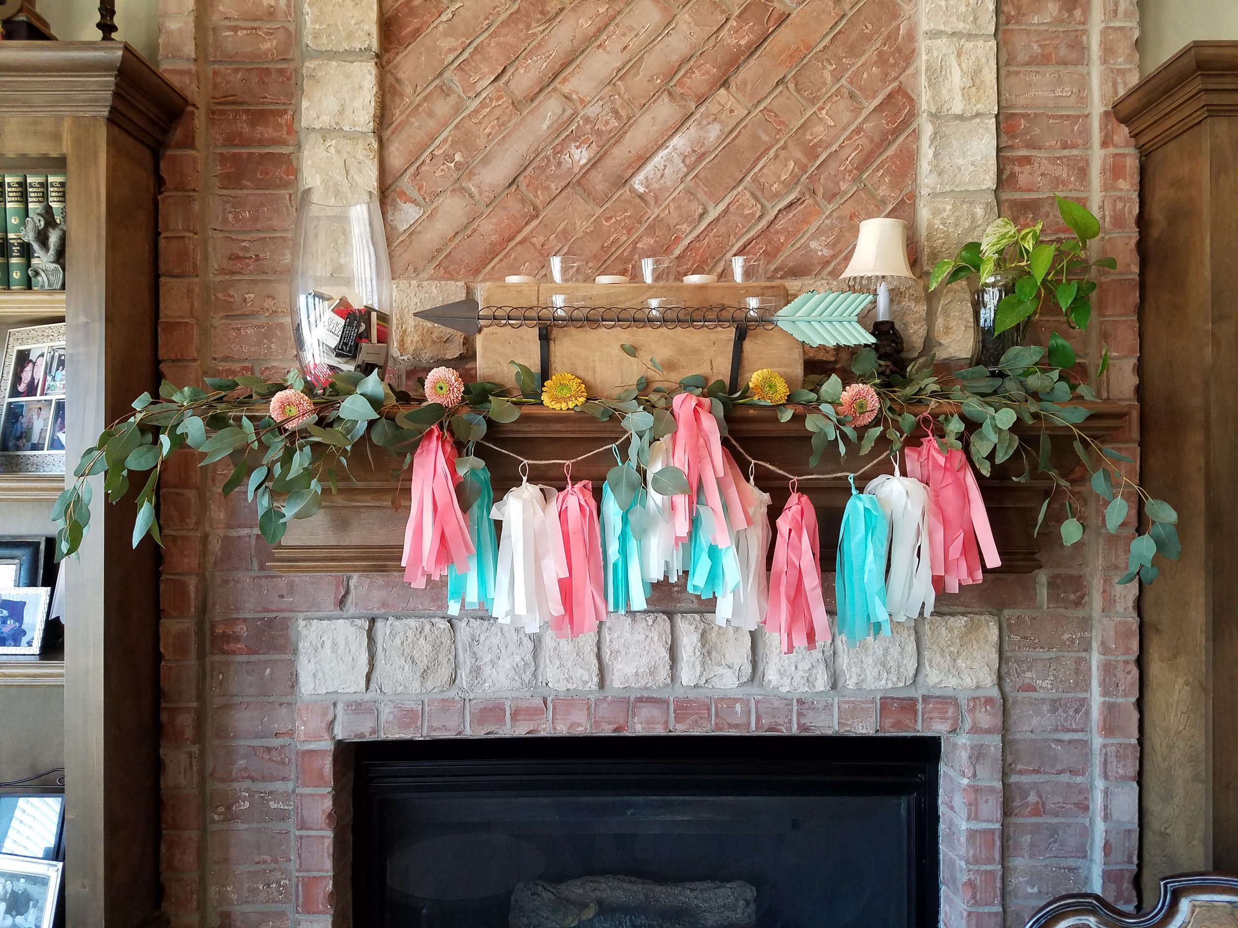 Flowers and eucalyptus as well as other items to jazz up the gift opening area.