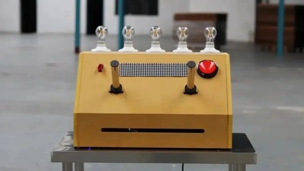 Electrocution Machine arcade-style science exhibit with five light bulbs, handles and a red button