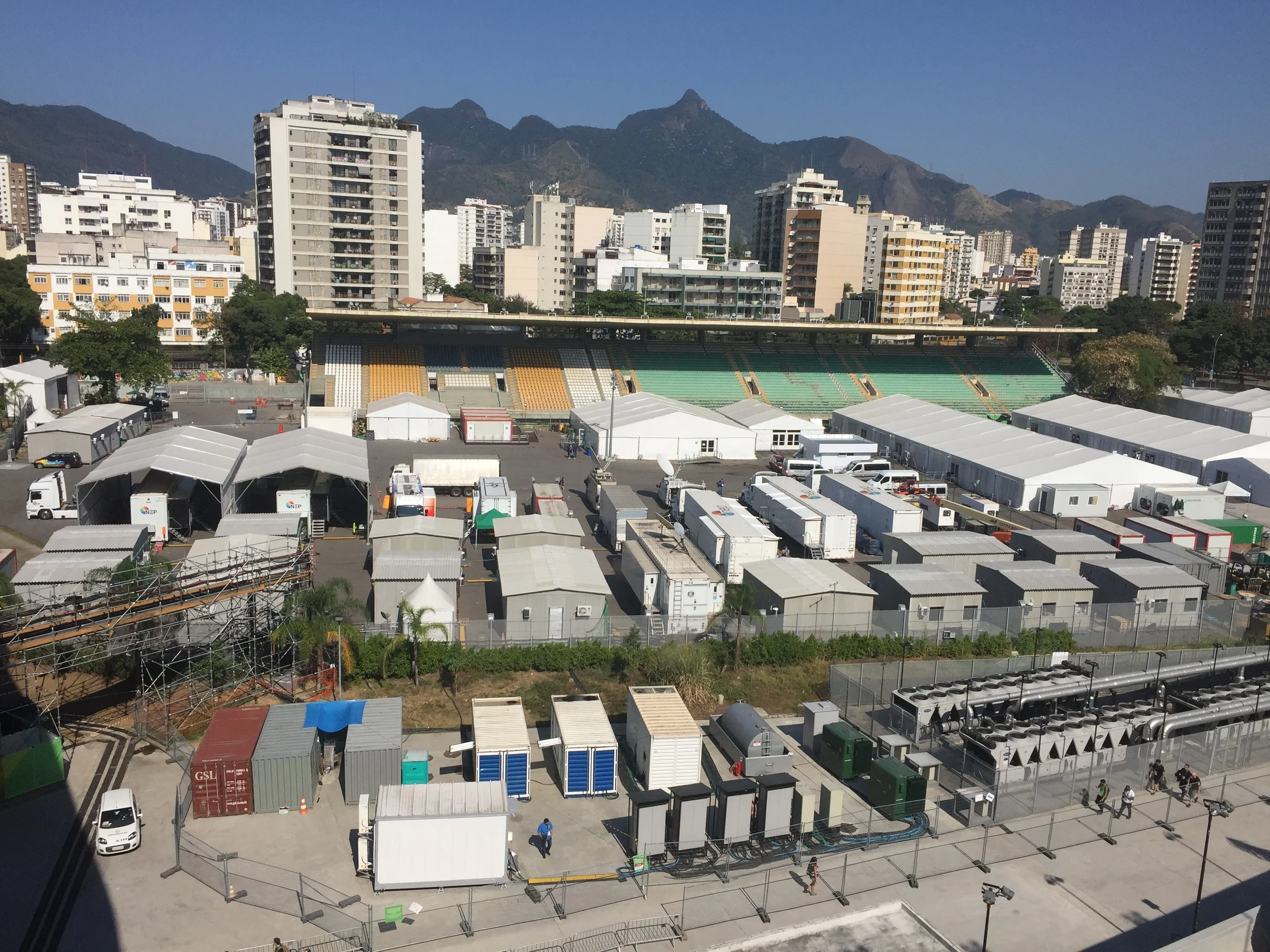 To the left of the sunset view on the right is the TV Compound With the Olympic Broadcasting trucks as well as NBC and other foreign broadcasters.