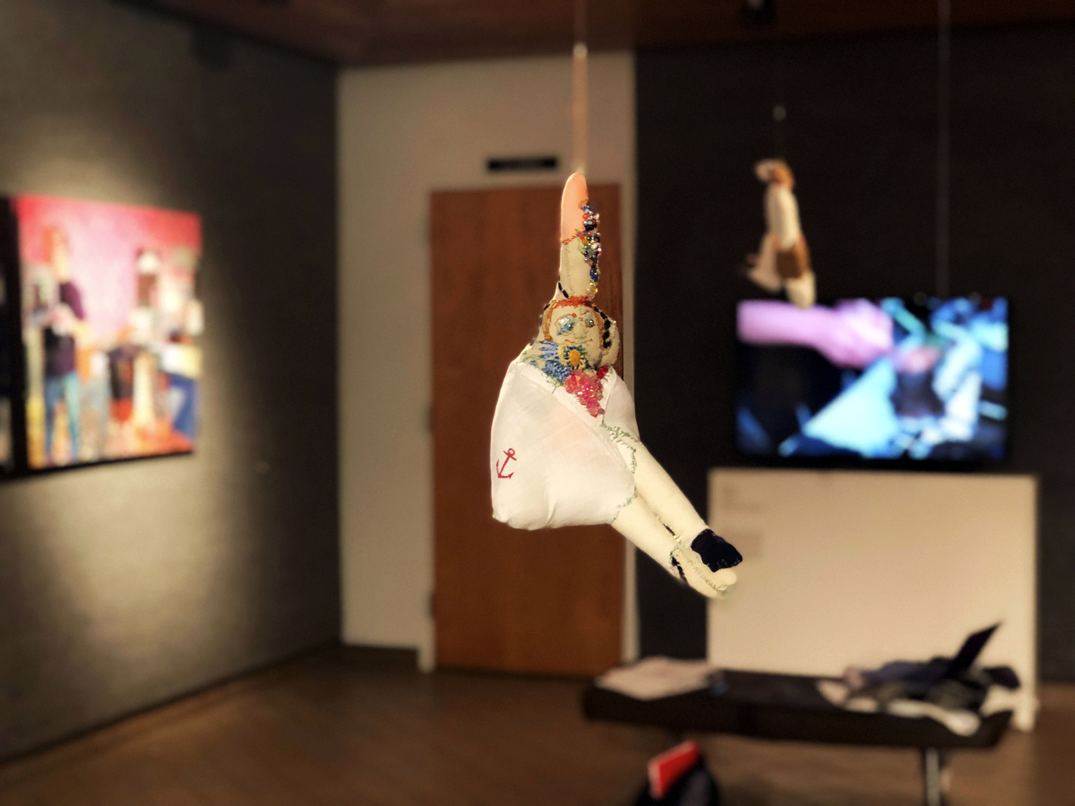 one of Maja Ružnić's sculptures, 'Leaning Woman', from her series 'Phantom Caravan' in foreground, with work by Danielle Mužina 'Fatherland' (left) and Aida Šehović 'ŠTO TE NEMA' (right) in 'Proof of Existence' at WKU