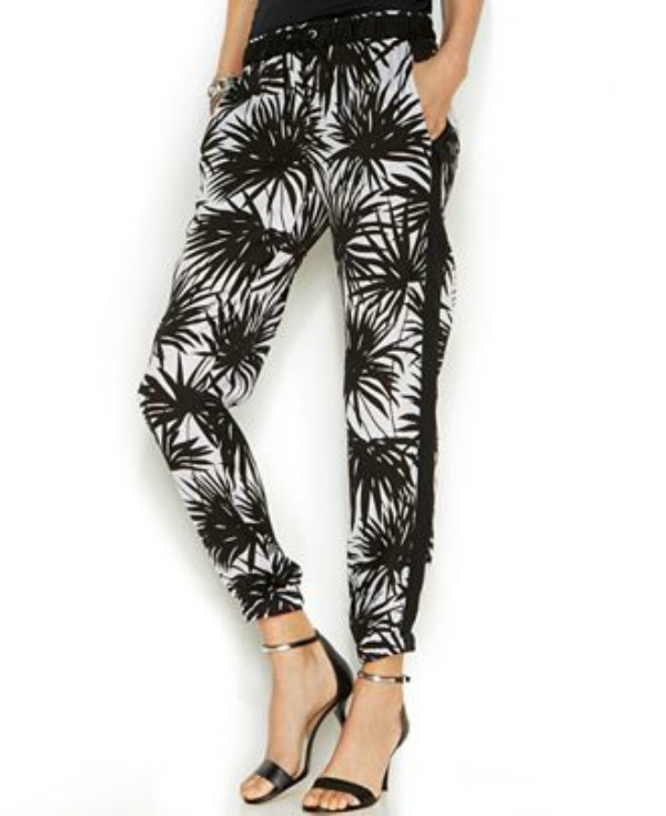 Track pants, just like the name implies, are simply gussied-up versions of what you wore to run cross country in junior high. They offer a bit more options for tops—wear tucked, untucked or half-tucked, loose or fitted. If you have wider hips or tummy trouble, you may want to pair with a blousy top that covers these areas. Fashion is all smoke and mirrors, my friends! Image credit: MichaelKors.com