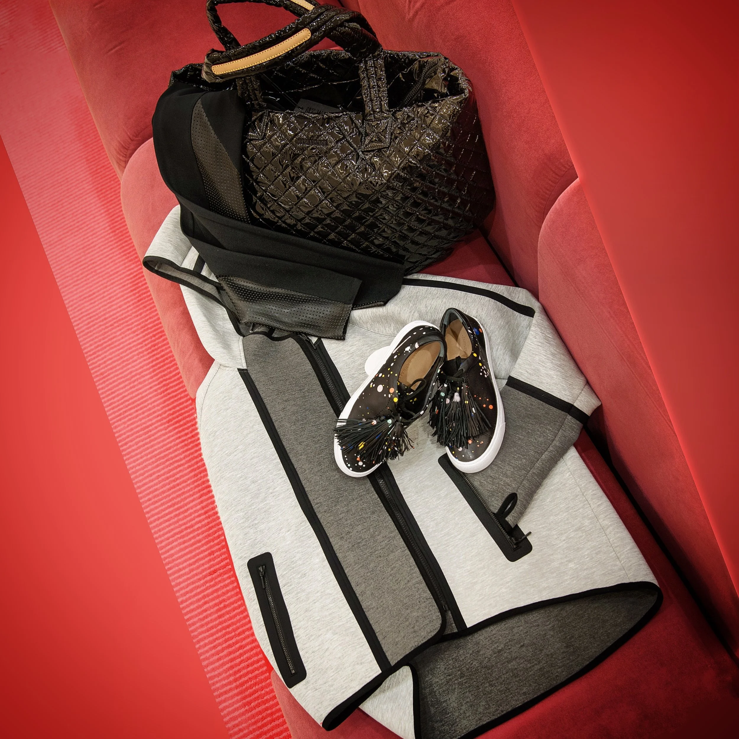 MZ Wallace Black Lacquer Large Metro Tote ($225), Spanx Perforated Panel Leggings ($98), Elie Tahari Sport Margie Jacket ($160, Loeffler Randall Logan Sneaker ($350). All from Saks Fifth Avenue.