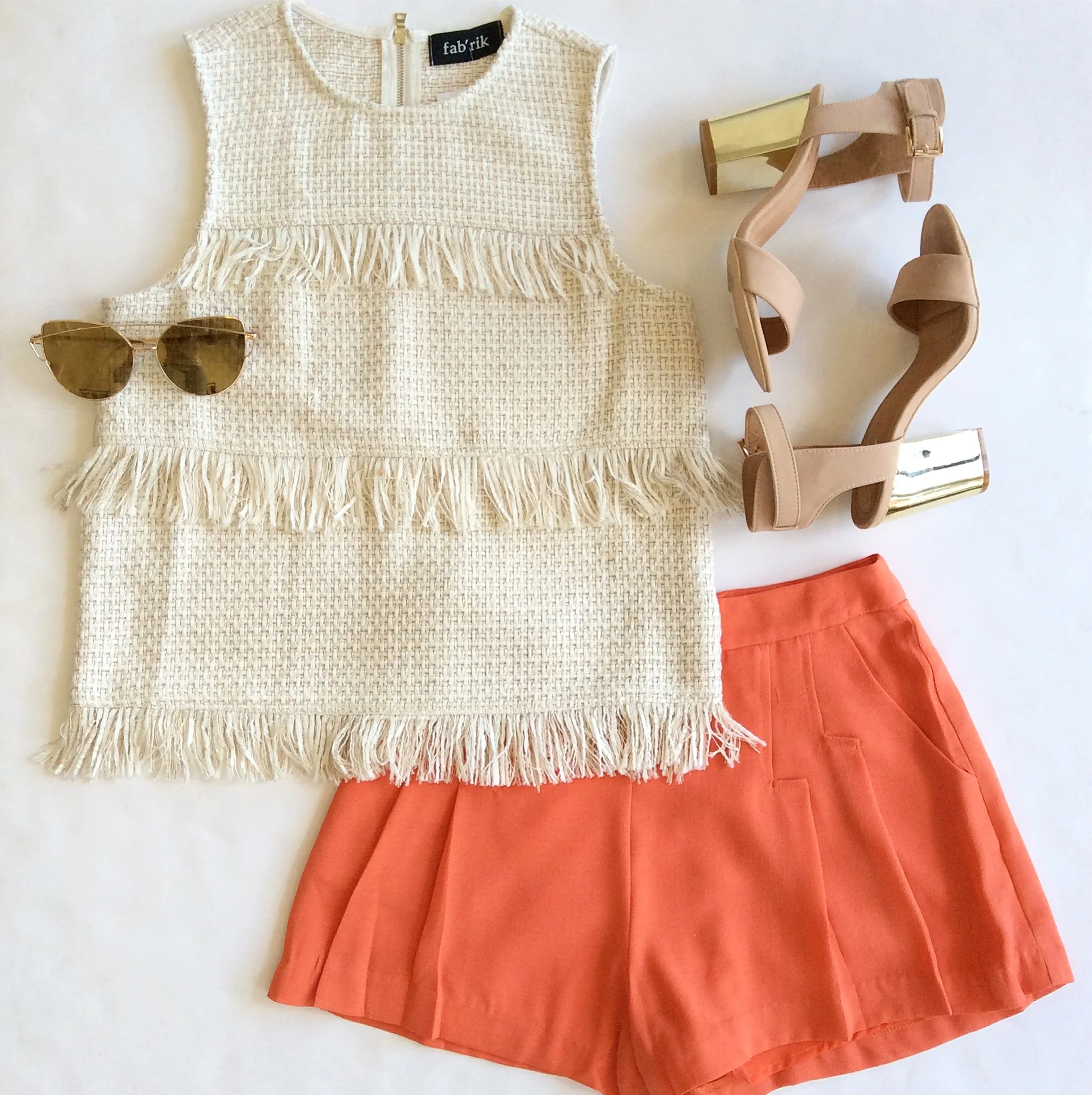 For interest & depth, I think outfits should have either a textured or printed element. I love this ladylike bouclé top paired with a pop of bold color, but it would look equally as good with white jeans for a sleek, monochromatic effect. Summer-staple nude sandals dress up the look.