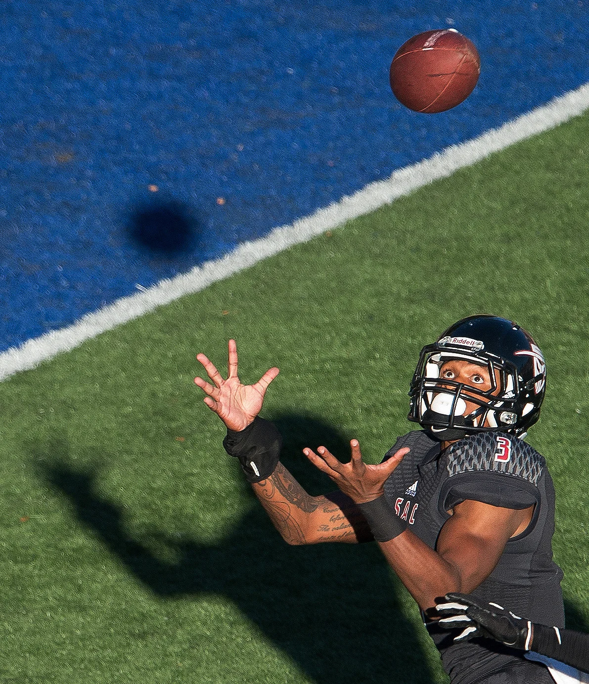 Santa Ana Dons wide receiver Malik Richards (3) catches a touchdown pass during the second half of a game against the Grossmont Griffins at Santa Ana Stadium.