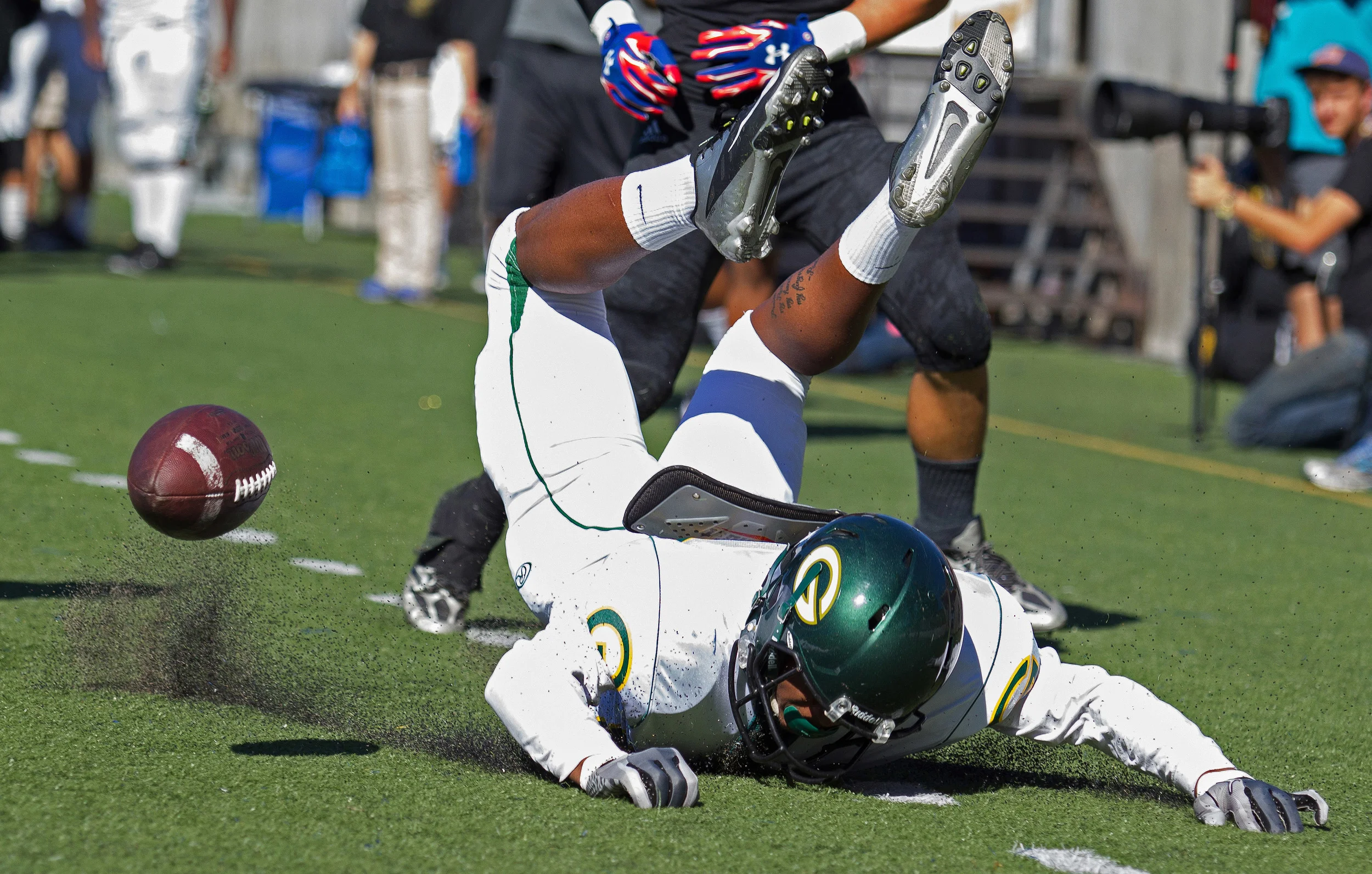Grossmont Griffins wide receiver Paul Gooden (85) lands out of bounds after attempting to dive for a touchdown during the first half of a game against the Santa Ana Dons at Santa Ana Stadium.