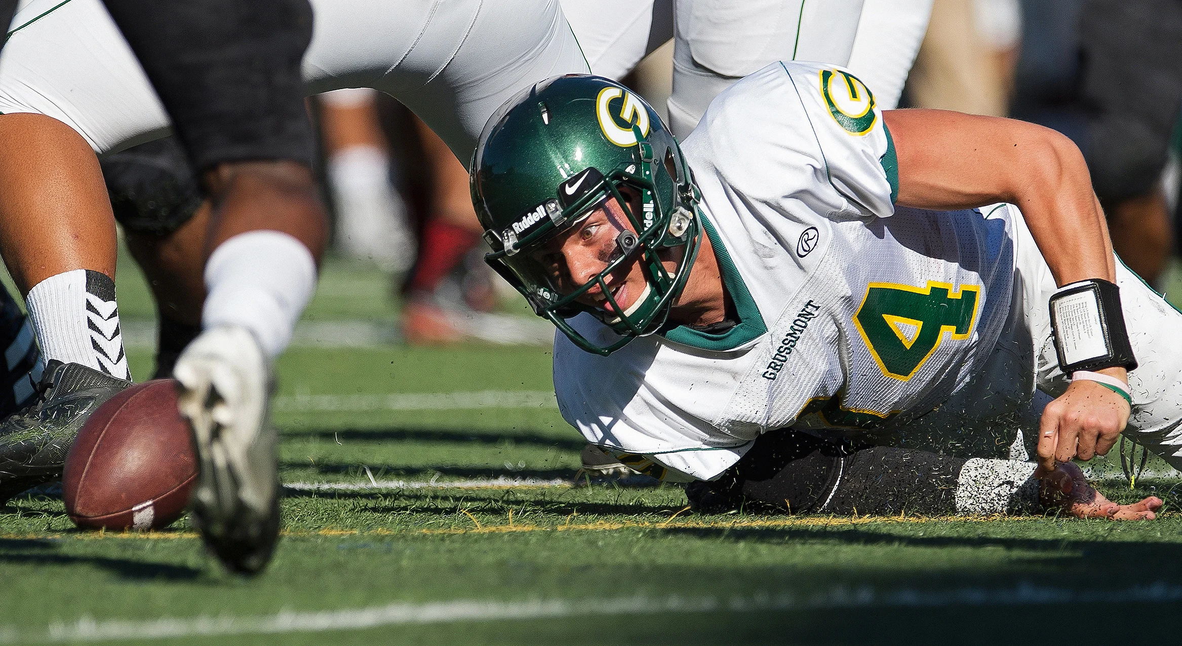 Grossmont Griffins quarterback Tommy Pistone (14) reacts after fumbling the snap during the first half of a game against the Santa Ana Dons at Santa Ana Stadium.