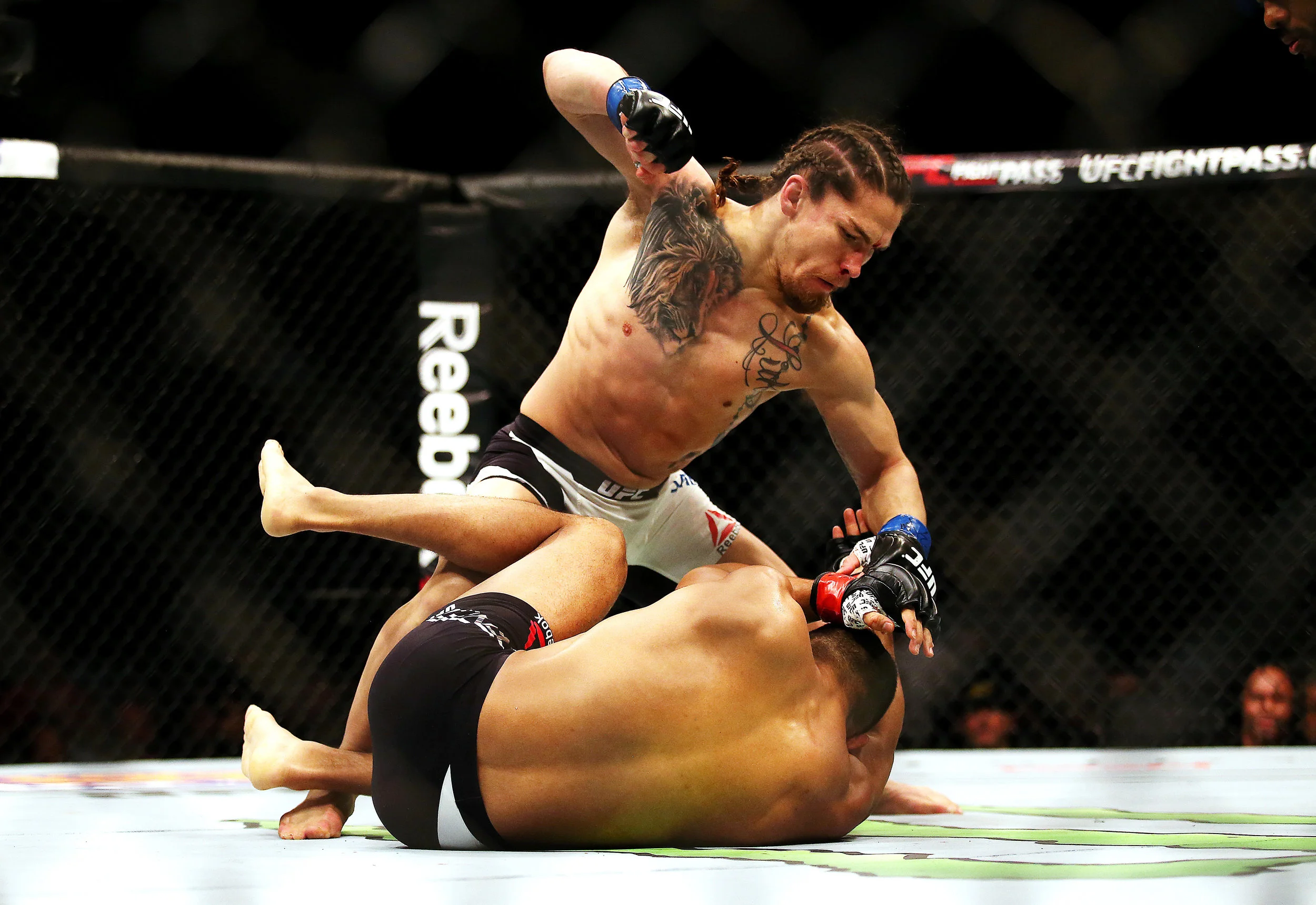 BOSTON, MA - JANUARY 17: Luke Sanders (top) punches Maximo Blanco in their featherweight bout during UFC Fight Night 81 at TD Banknorth Garden on January 17, 2016 in Boston, Massachusetts. (Photo by Tim Bradbury/Getty Images)