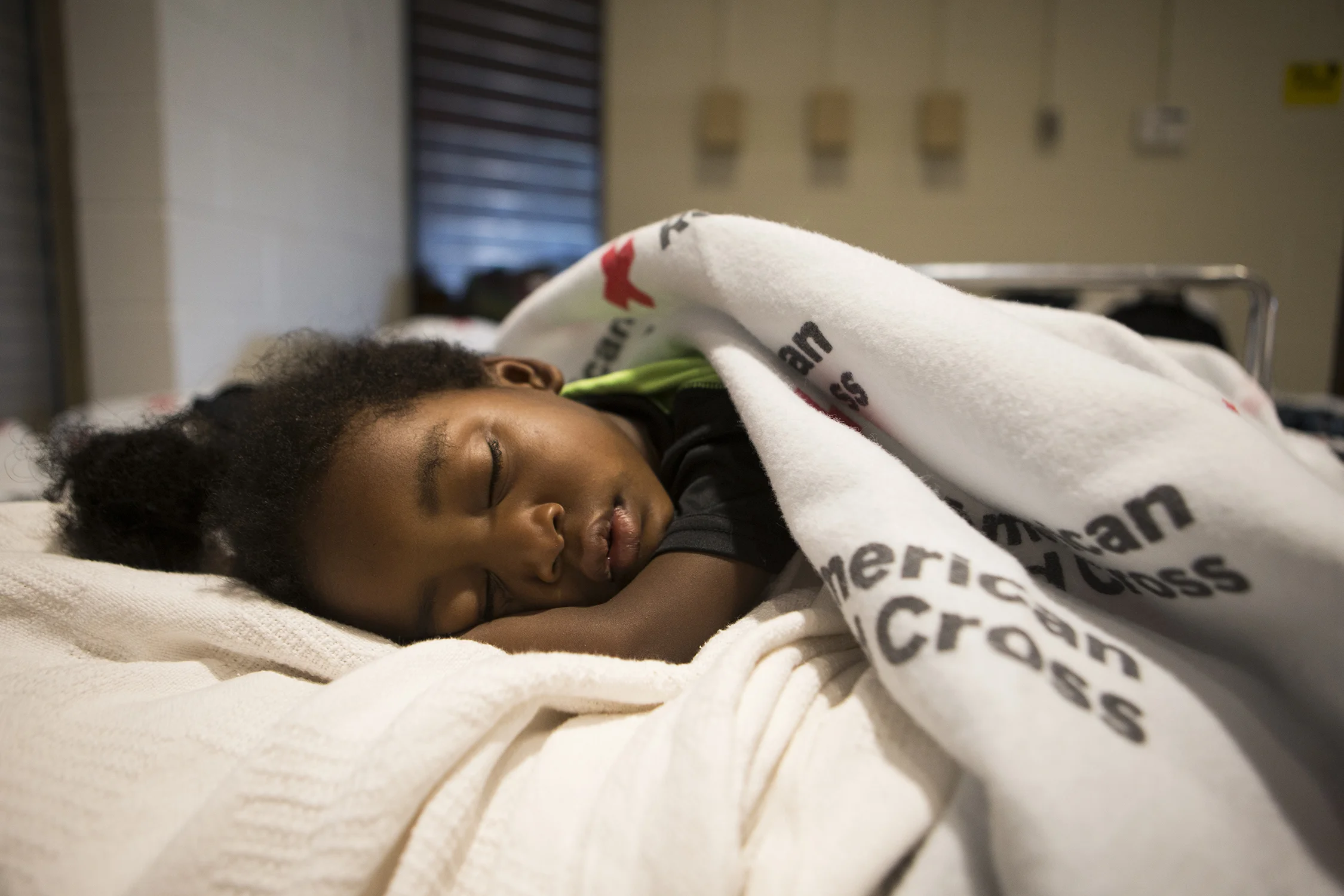  Adrian Brown, 3, sleeps at the emergency shelter at Rutherford High School after Hurricane Michael in Panama City, Florida on Saturday, October 13, 2018. As windows broke and the roof peeled away during the storm his seven-year-old sister A'Eria Bro