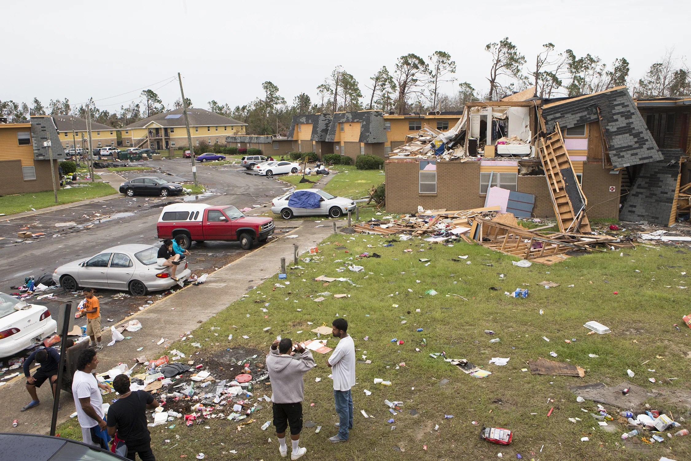  Residents talk at the Macedonia Gardens apartments in Panama City, Florida on Tuesday, October 23, 2018.   