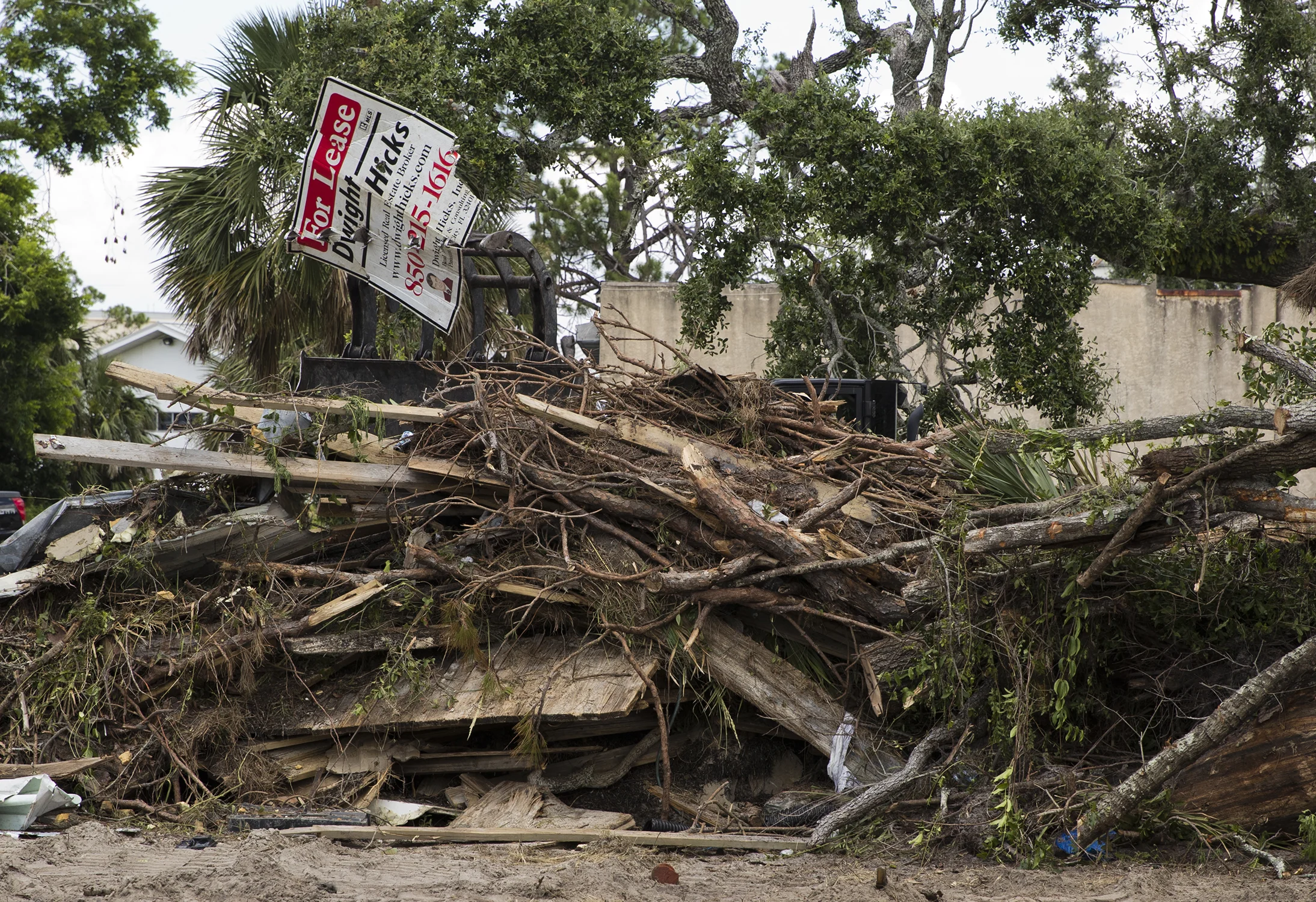  City workers clear debris from Hurricane Michael and garbage from a lot near the corner of West Beach Drive and Mercer Avenue in downtown Panama City, Florida on Tuesday, June 11, 2019.  