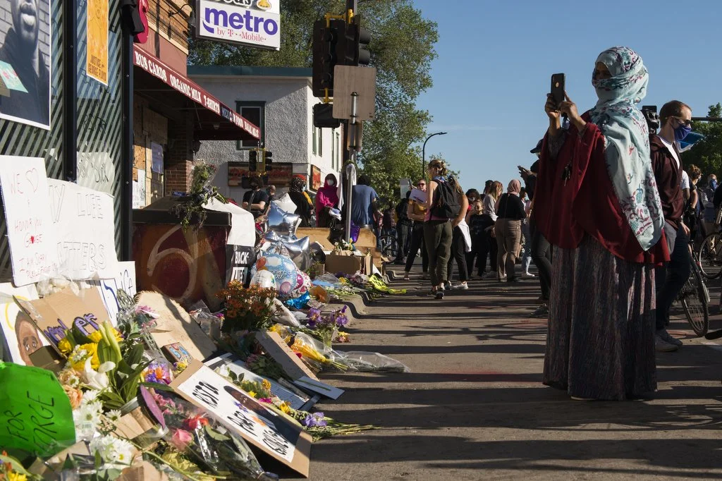  Mourners gather outside Cup Foods, a convenience store, to honor the memory of George Floyd who died after Minneapolis Police Department officer Derek Chauvin knelt on his neck for more than seven minutes in Minneapolis, Minnesota on Friday, May 29,