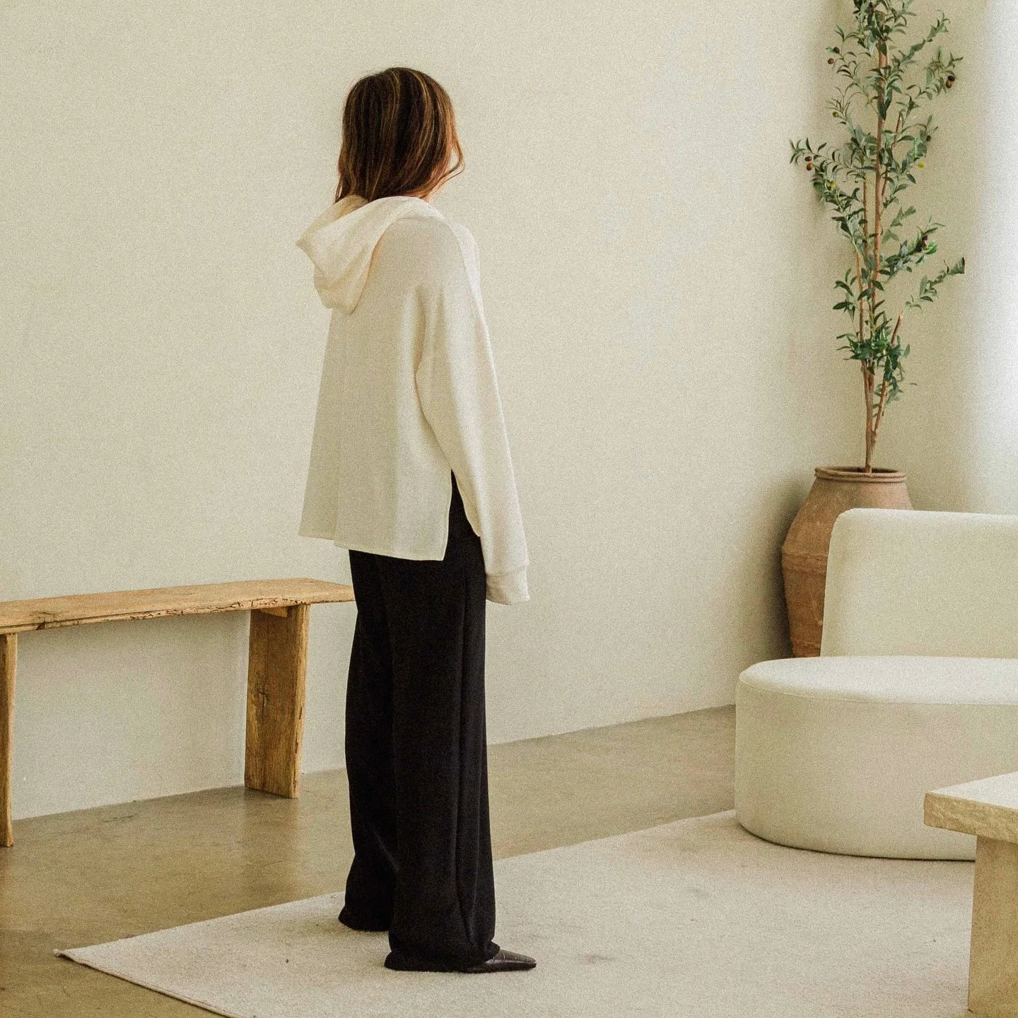 The Camden Hoodie is a new style with a shorter front hem and slits on both sides. Everyone loves a hoodie transitioning from summer into fall and a cropped version would be the Pia Cropped Hoodie. #corinnecollection #fw25 #aw25