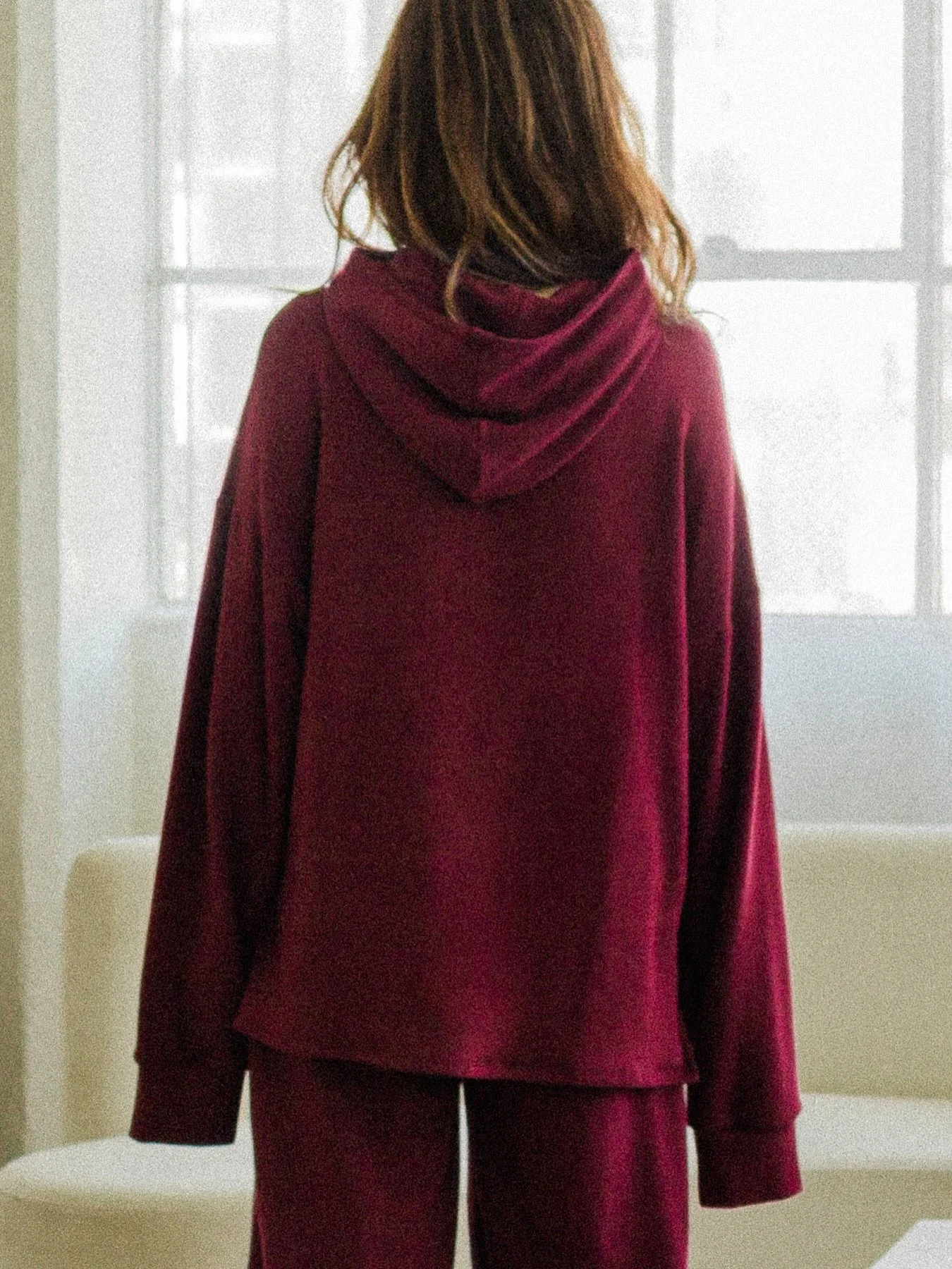 The Camden Hoodie is a new style for FW25 and has quickly become a fan favorite. It has a shorter front seam and drop shoulder detail&mdash;it also has the Corinne signature look which is super long sleeves. Seen here in Cranberry. 🍒 #corinnecollect
