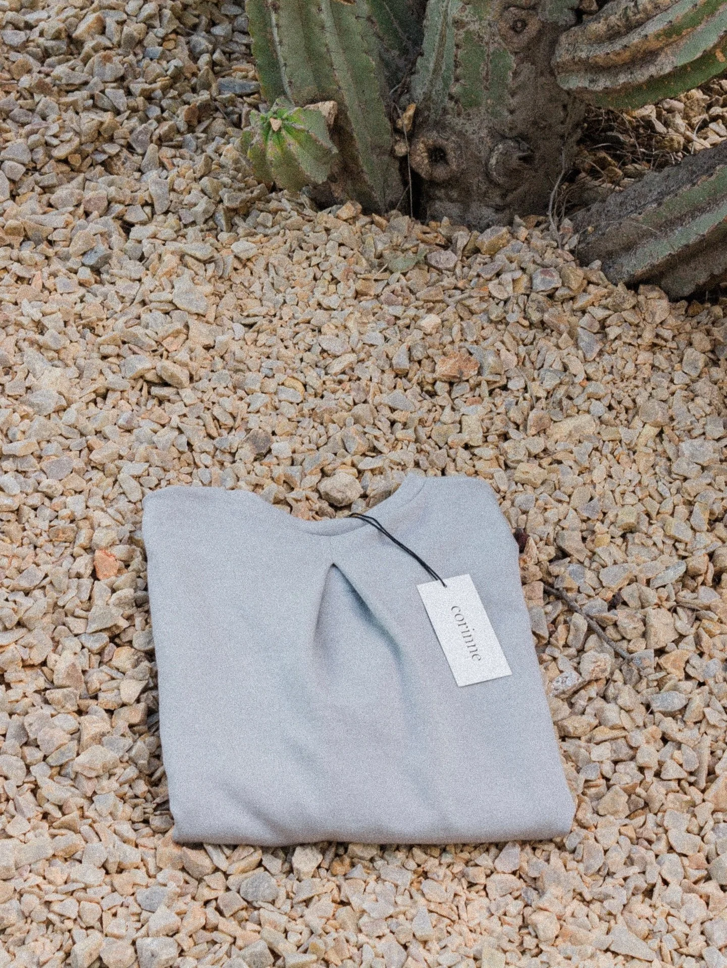 The subtle pleat detail on the Ella Back Pleat Top in Light Grey. #corinnecollection