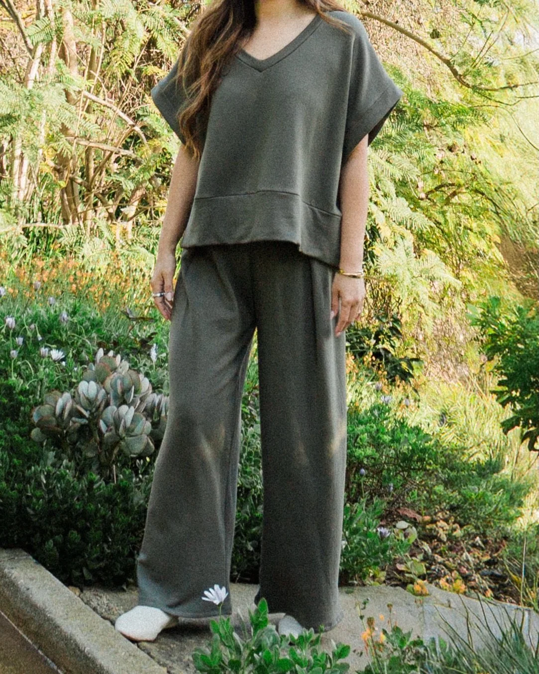 The Pico Sweater Vest was a fall/winter style but you loved it so much the style is now available in the spring/\summer. The perfect transitional piece through the seasons and seen here in Olive paired with the Jojo Pleat Pant. #corinnecollection