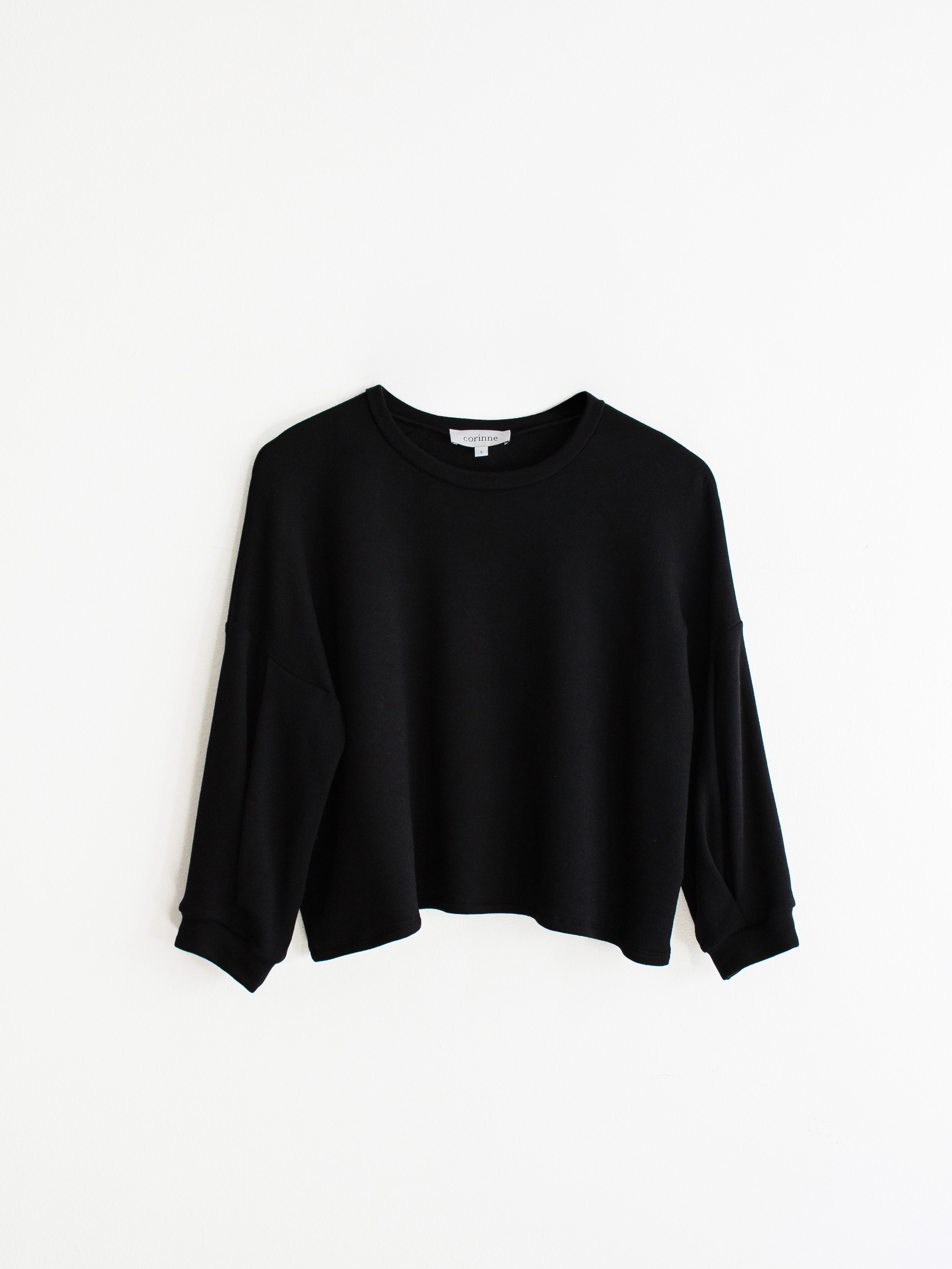 3/4 sleeve top with pleats at sleeves.