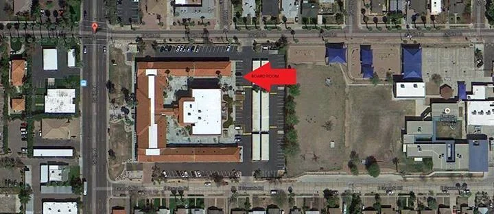 The board room can be found on the east side of the building, off the parking lot.