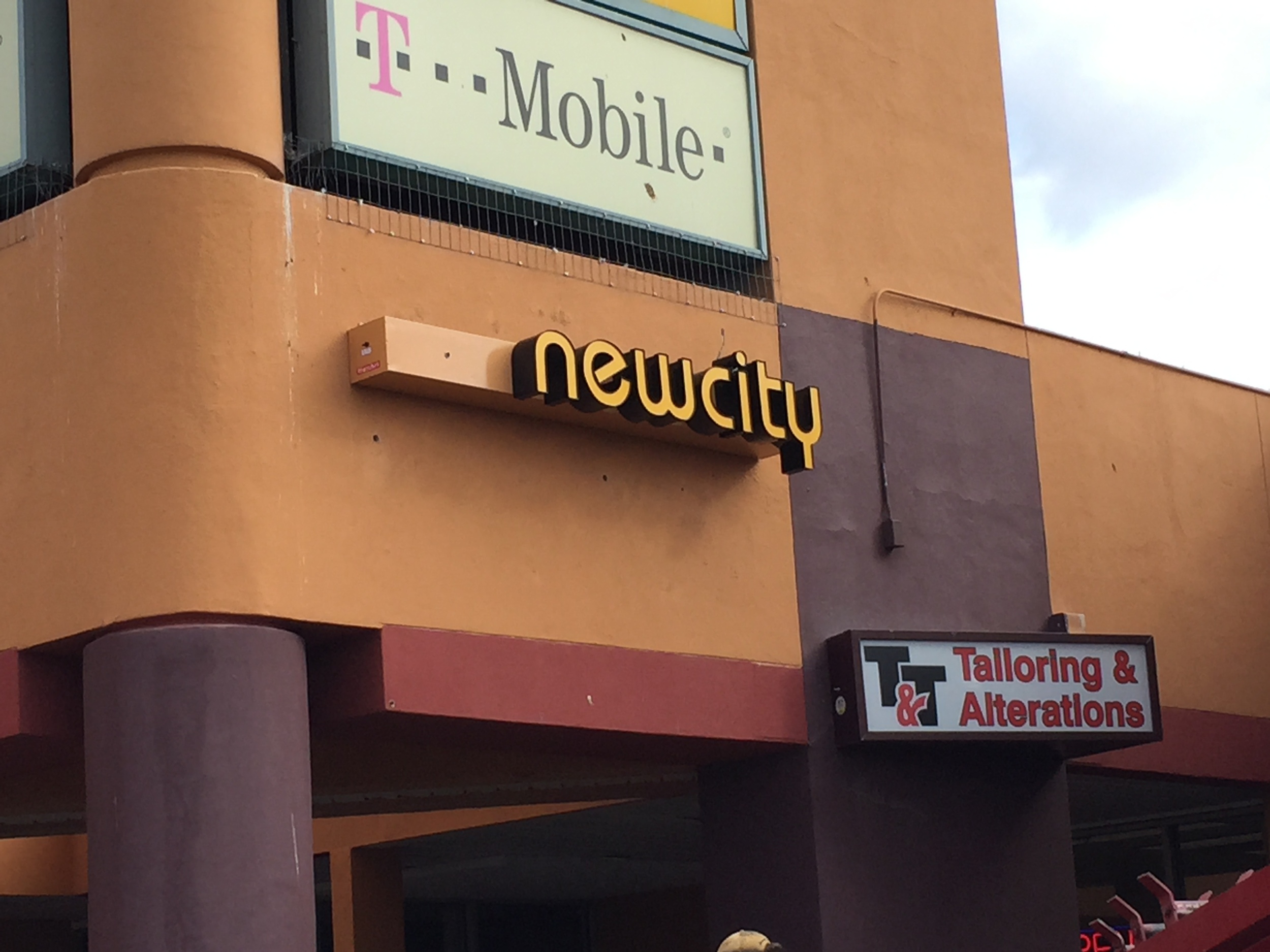 A progression of the one of the signs being installed: 1 of 3