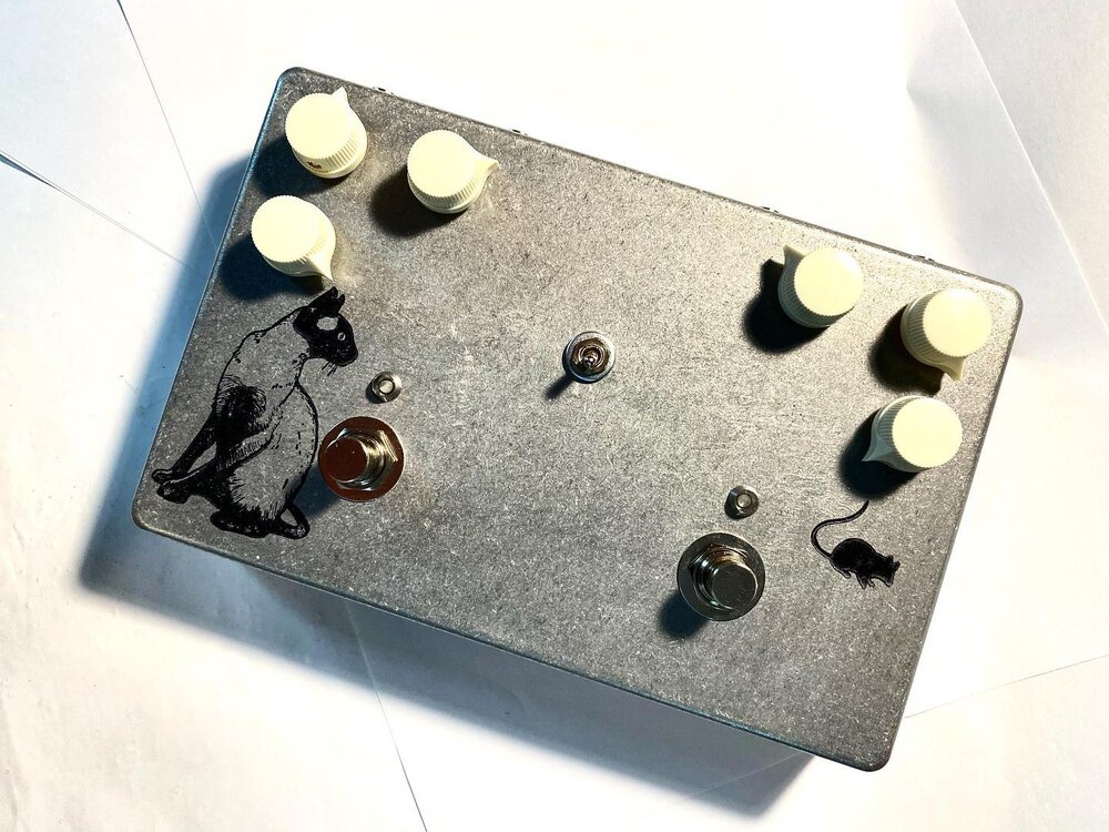 Woof! This one almost made us go off the rails! Rat Distortion with the OG LM308 chip on one side &amp; our sparkle sound tremolo on the other. Order toggle in the middle to flip/flop them into each other. What&rsquo;s more: send/return jacks up top 
