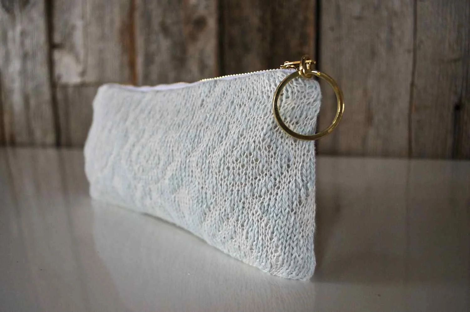 This lovely linen pouch is available in the shop . 
