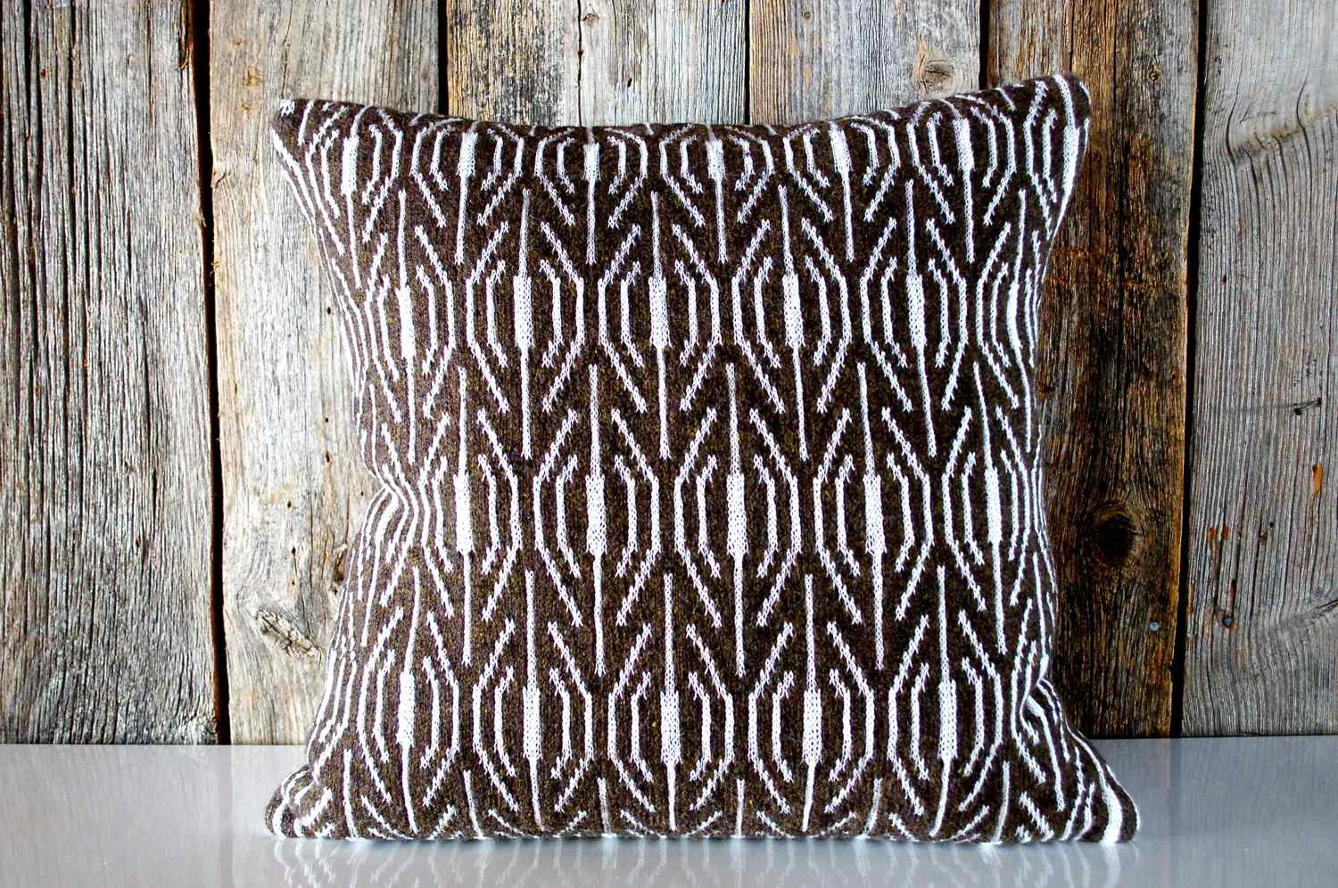 Large pillow in Walnut, knit in the MORAY design Available now in the store. Cheesestick and other munchables not included.