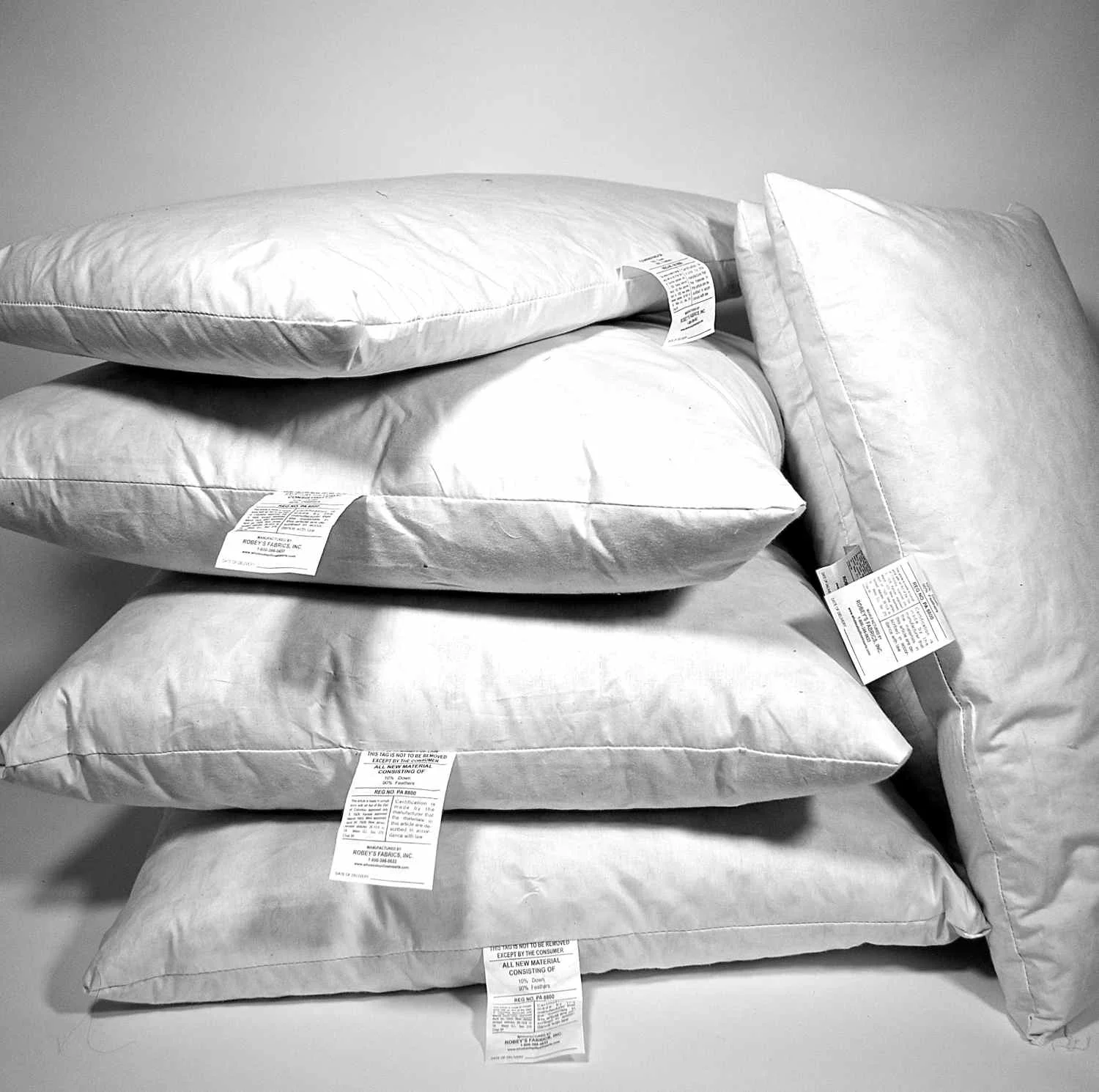 A stack of our down and feather pillow inserts. And yes, occasionally they're V-chopped just for fun and stress relief in the studio . . .